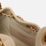 Chanel 25 shoulder bag in beige color and grained calfskin material in GHW 