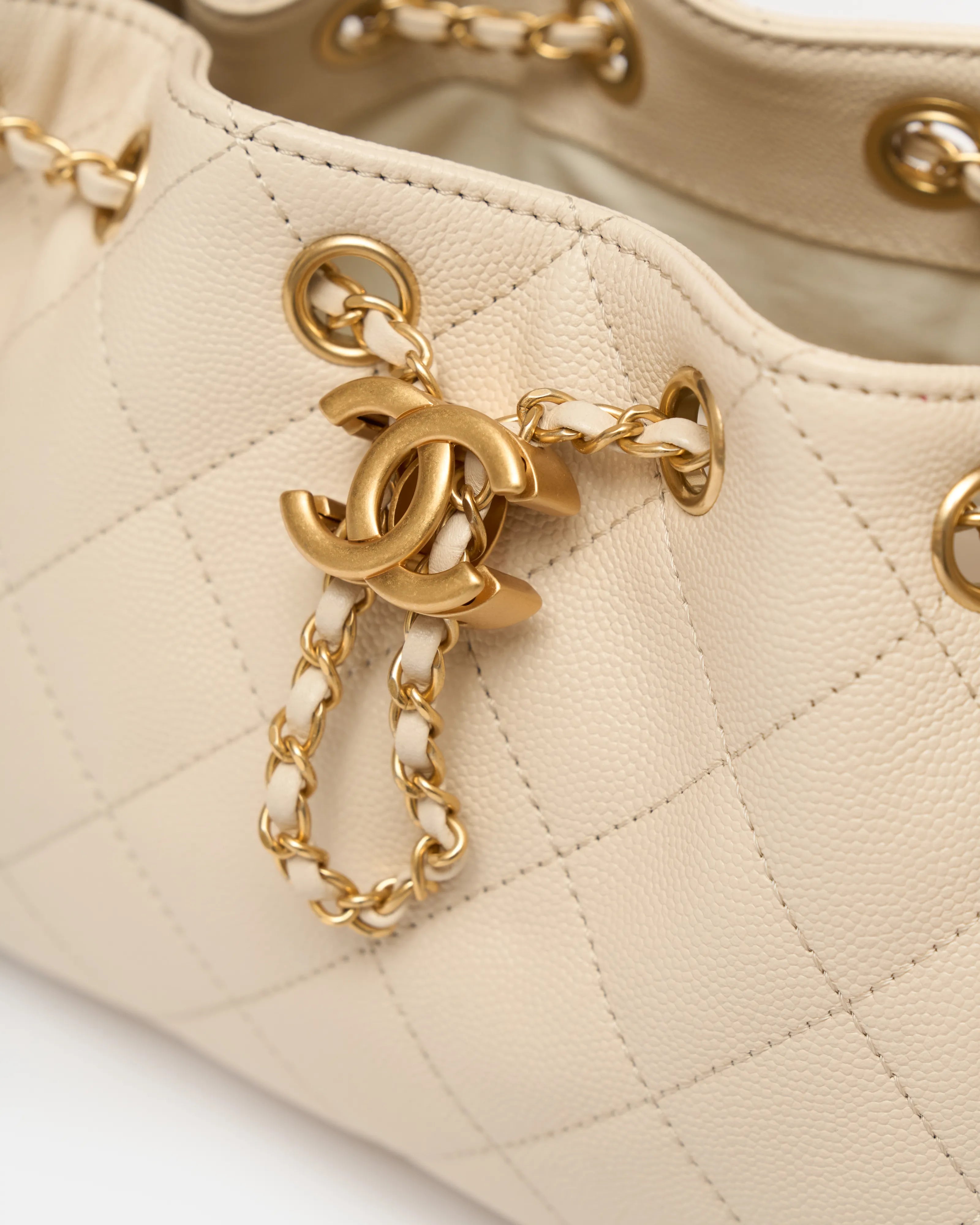 Chanel 25 shoulder bag in beige color and grained calfskin material in GHW 