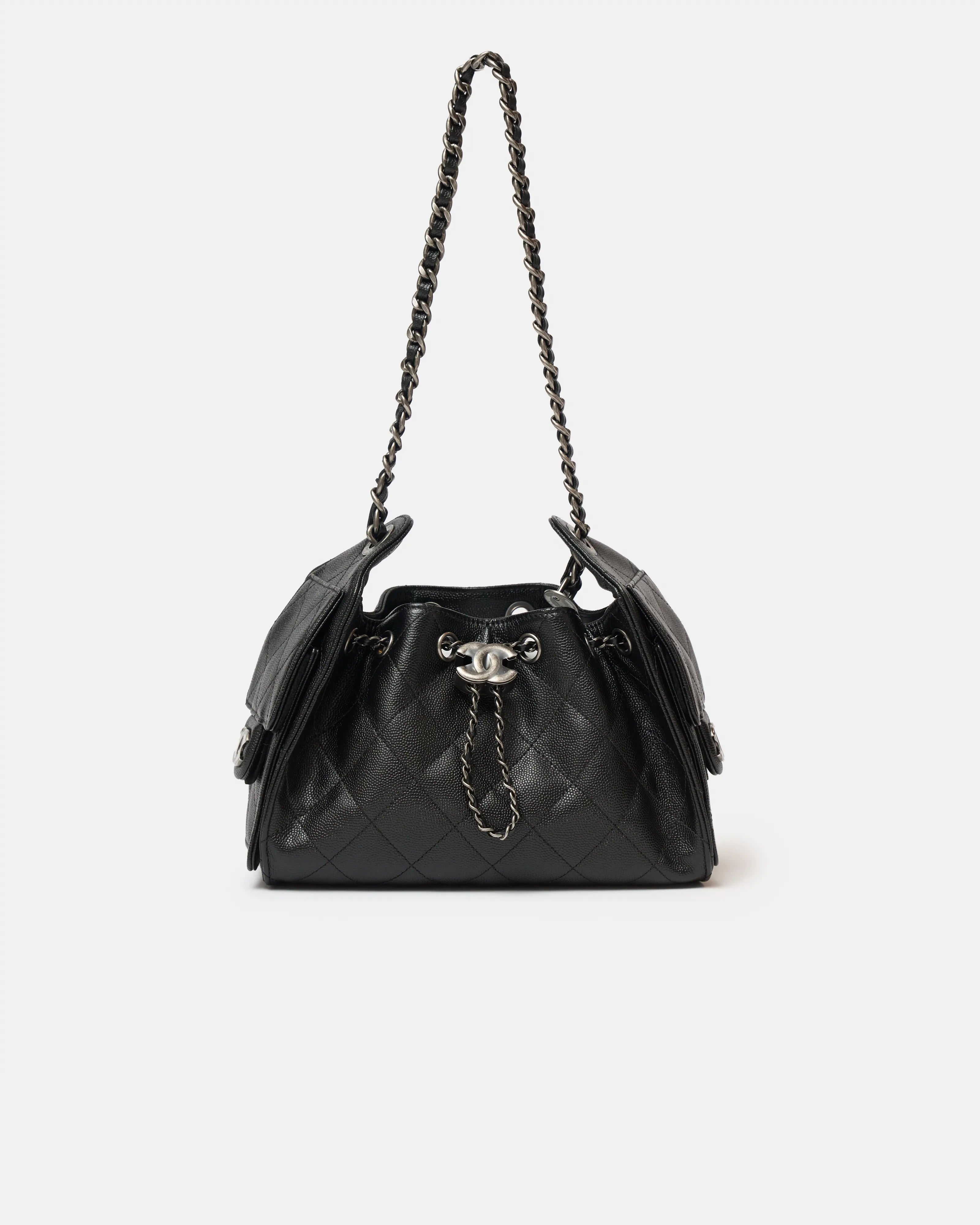 Chanel 25 shoulder bag in black color and grained calfskin material in PHW 