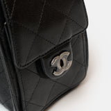 Chanel 25 shoulder bag in black color and grained calfskin material in PHW 