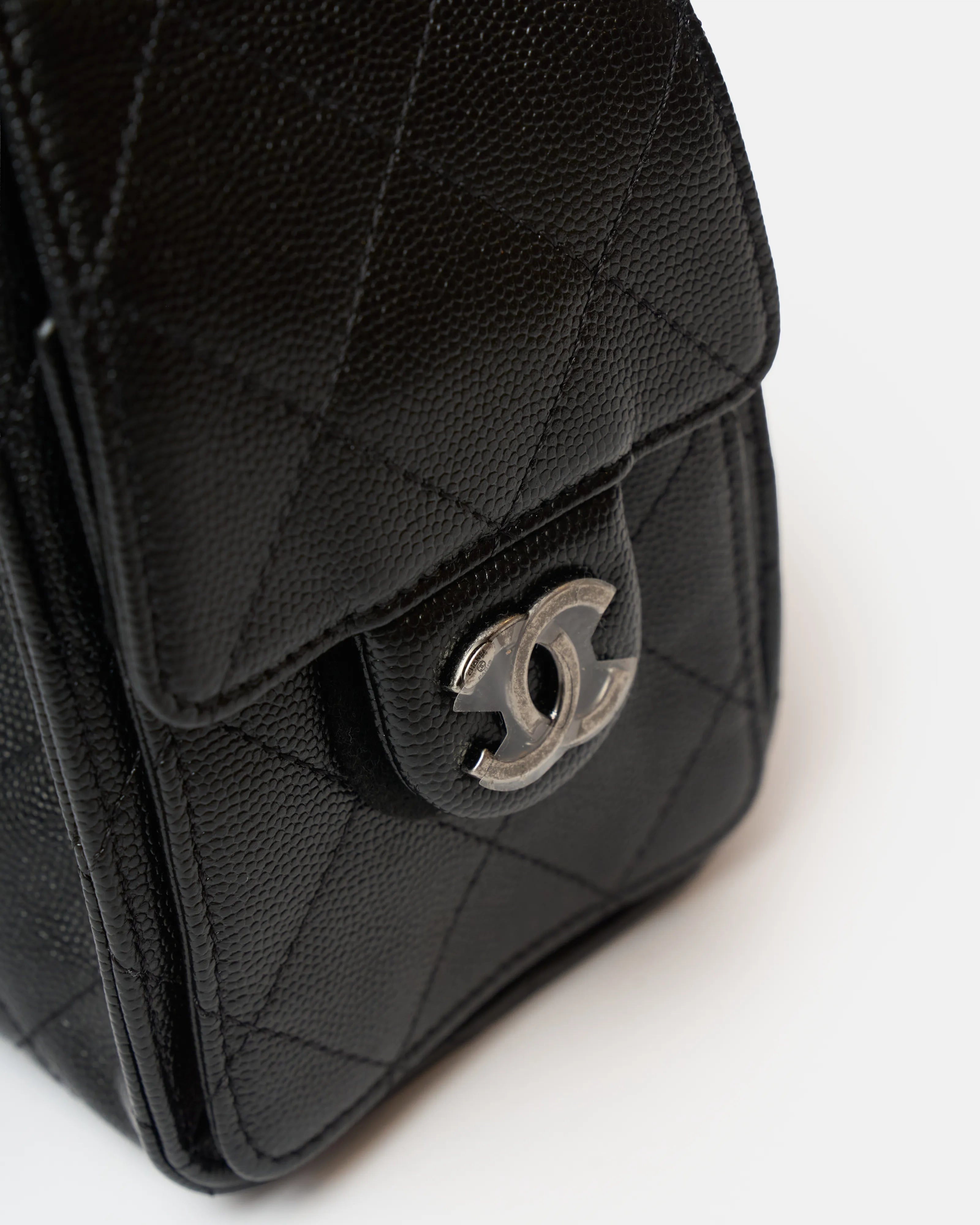 Chanel 25 shoulder bag in black color and grained calfskin material in PHW 