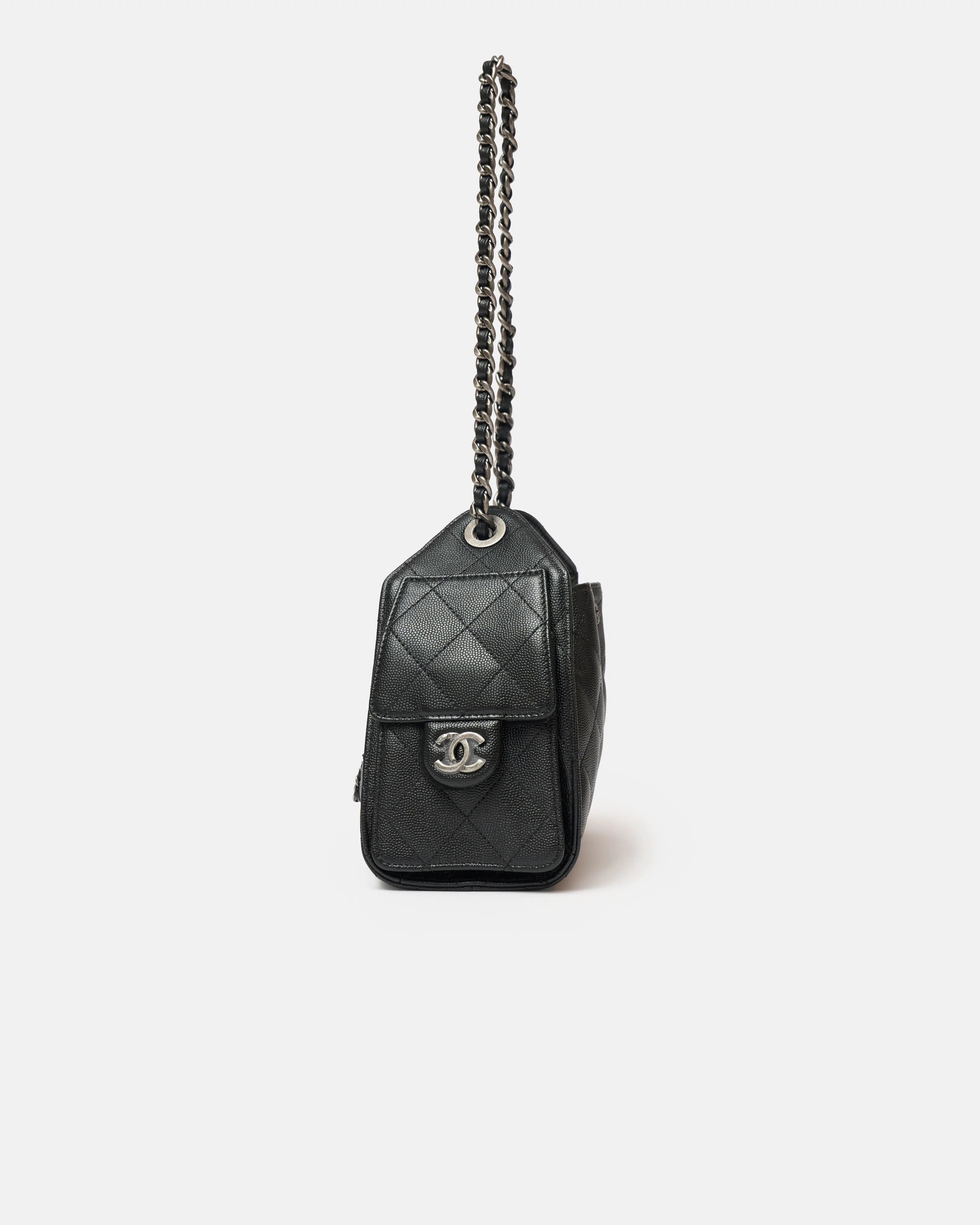 Chanel 25 shoulder bag in black color and grained calfskin material in PHW 