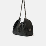 Chanel 25 shoulder bag in black color and grained calfskin material in PHW 