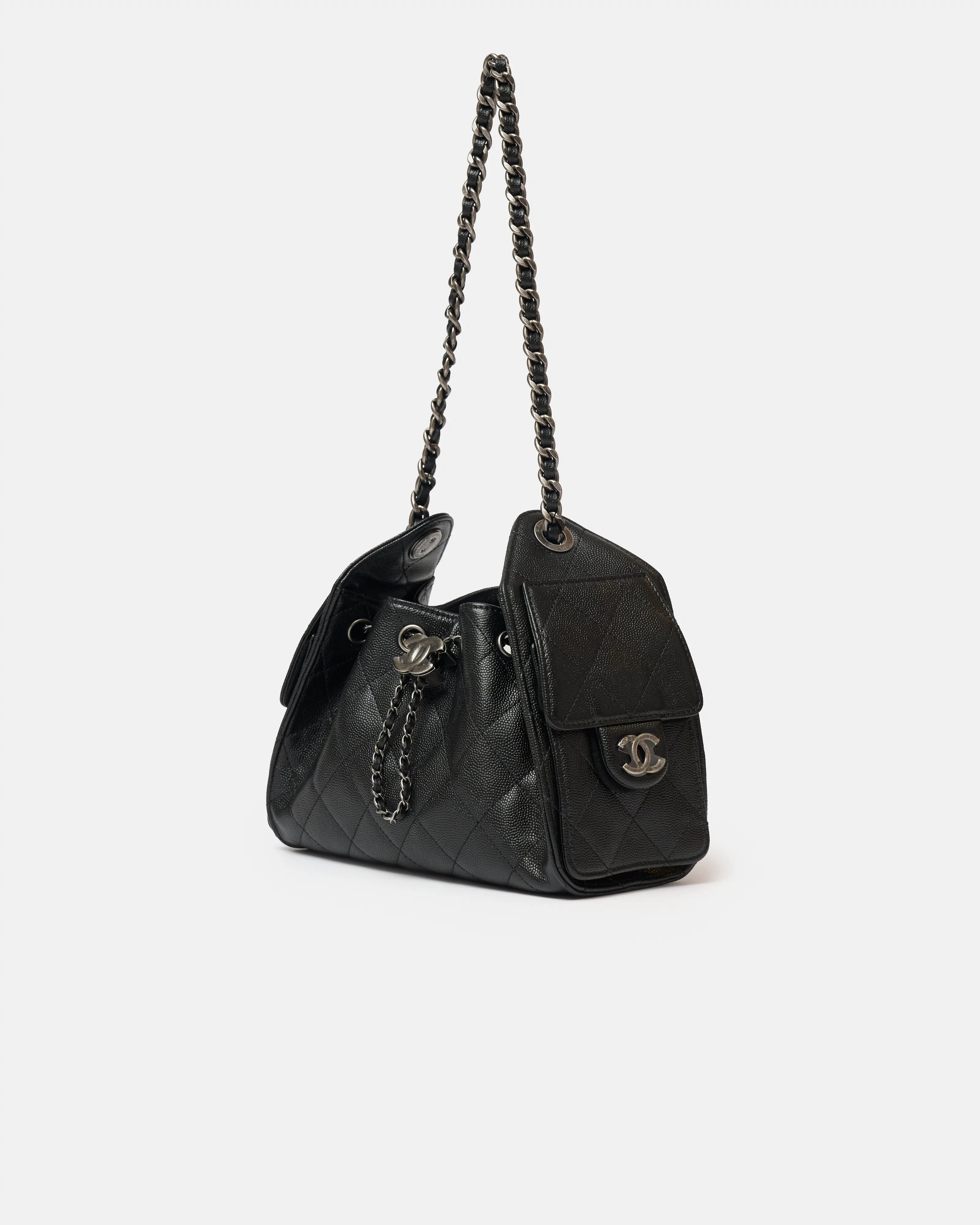 Chanel 25 shoulder bag in black color and grained calfskin material in PHW 