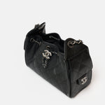 Chanel 25 shoulder bag in black color and grained calfskin material in PHW 