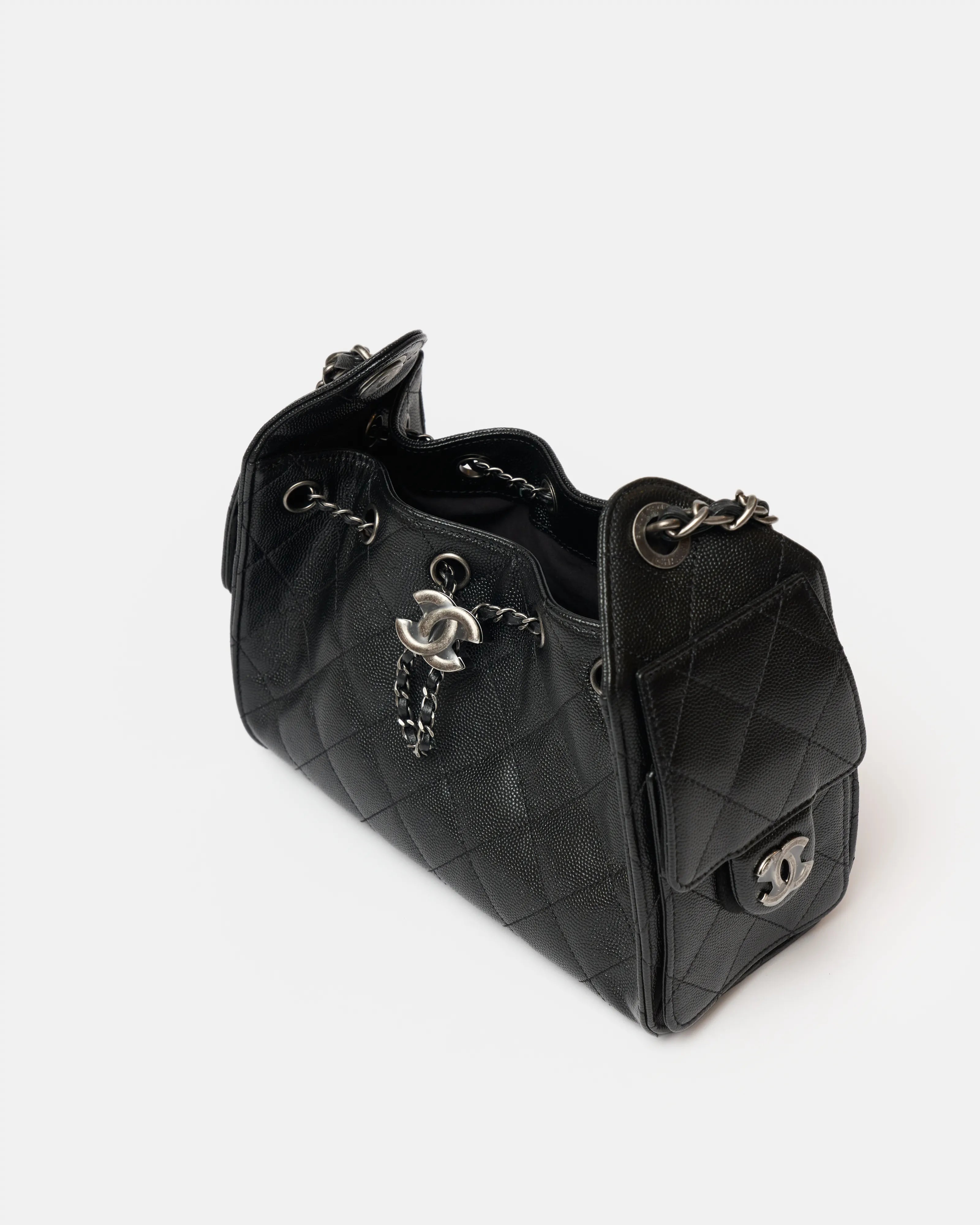 Chanel 25 shoulder bag in black color and grained calfskin material in PHW 