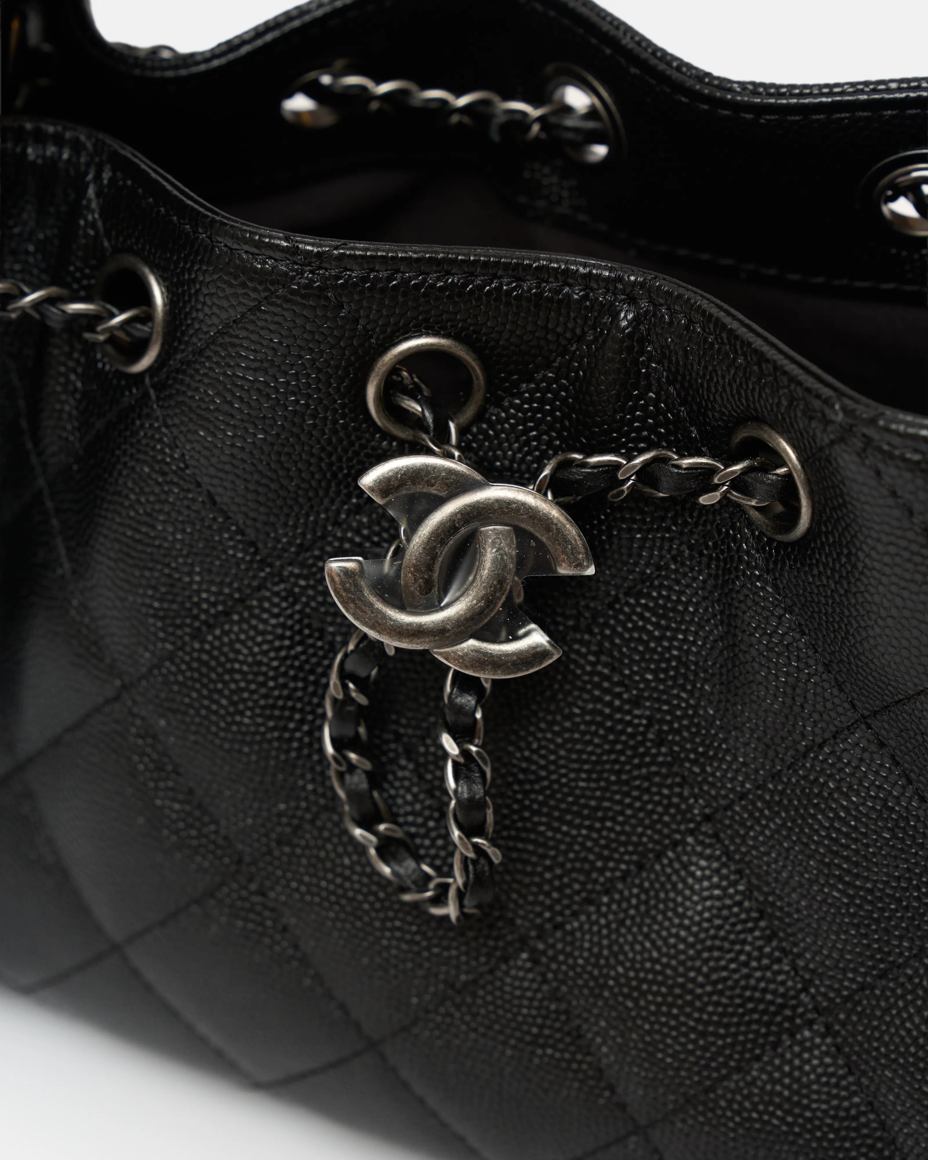 Chanel 25 shoulder bag in black color and grained calfskin material in PHW 