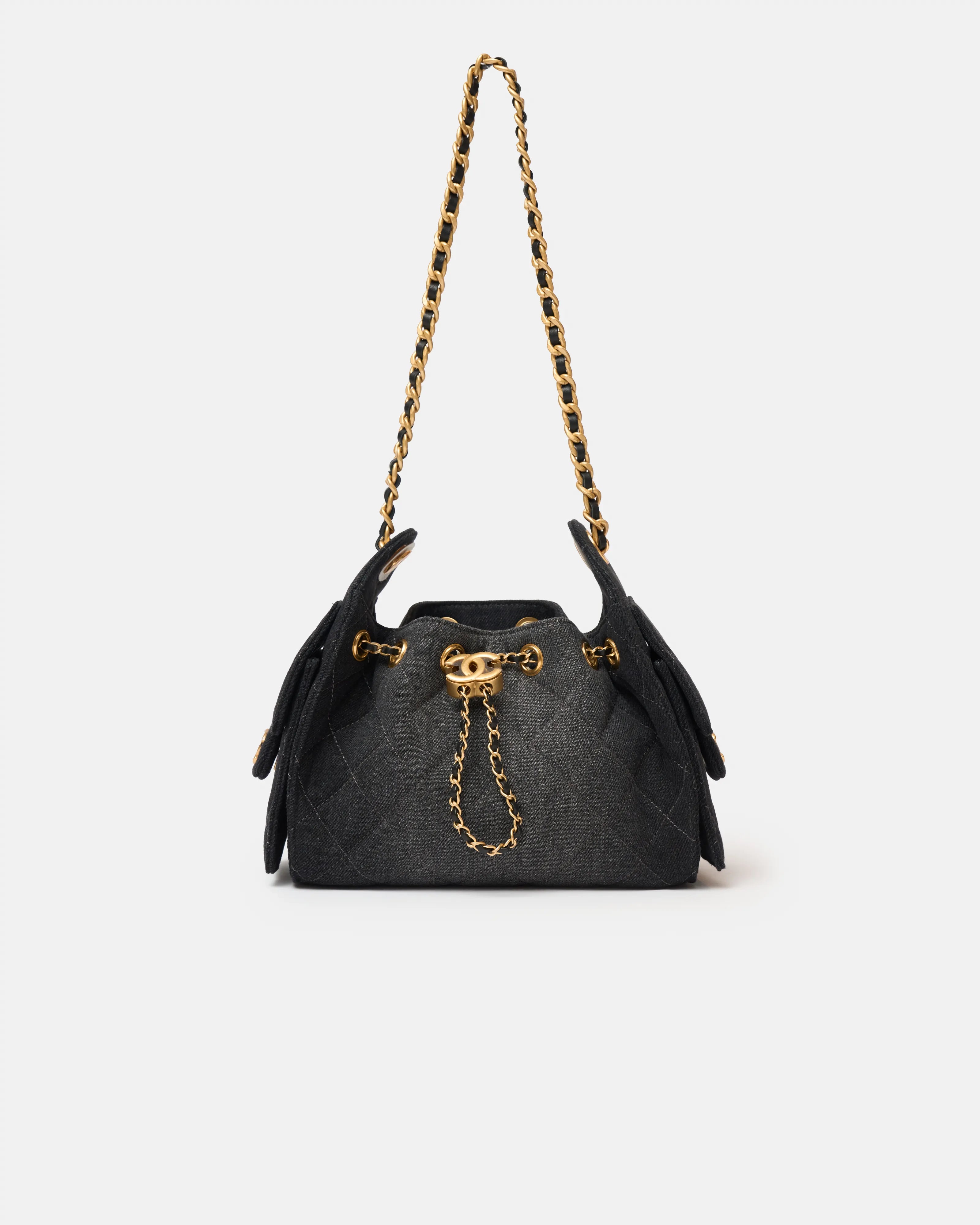Chanel 25 shoulder bag in black color and washed denim material in GHW 