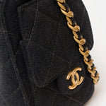 Chanel 25 shoulder bag in black color and washed denim material in GHW 