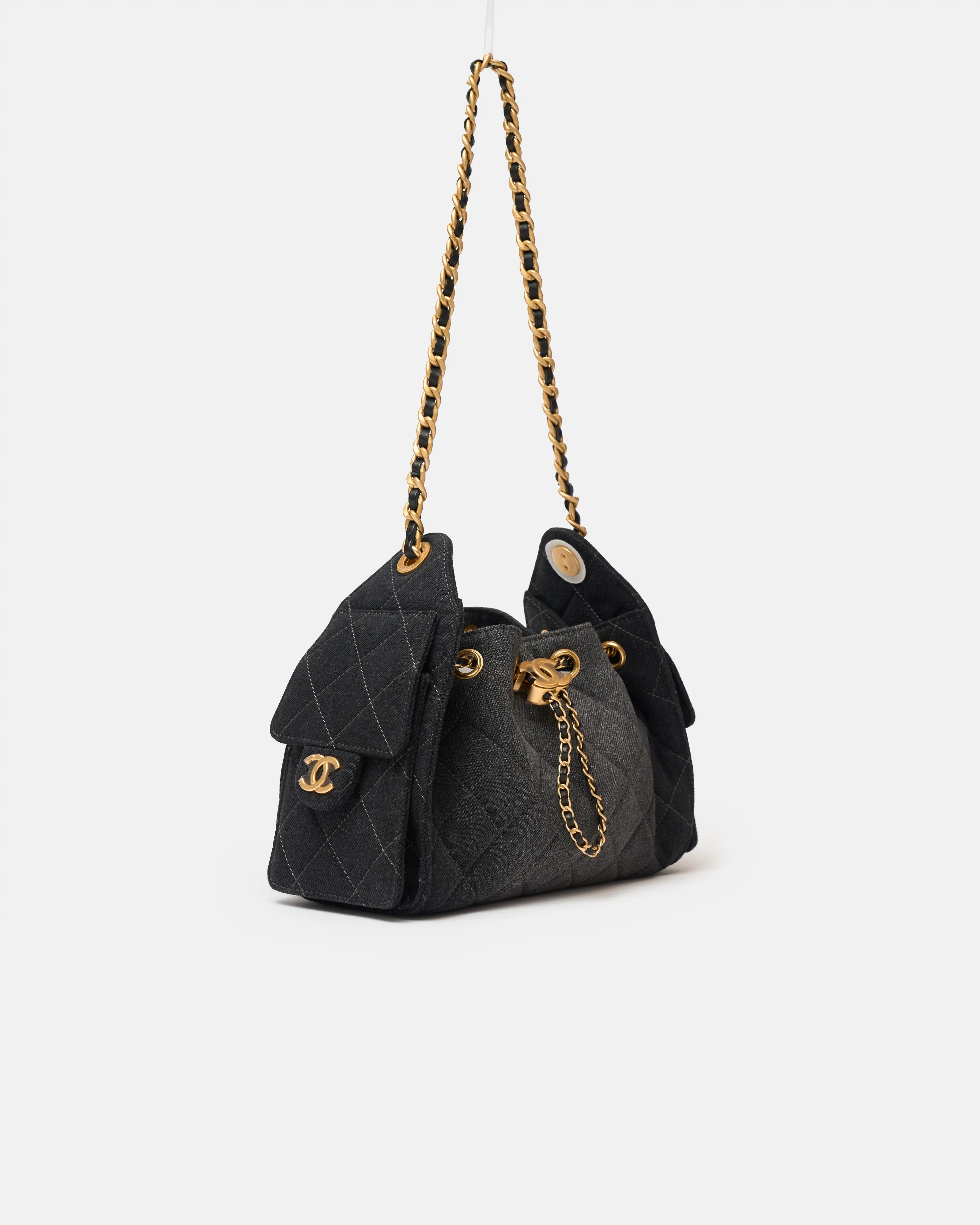 Chanel 25 shoulder bag in black color and washed denim material in GHW 