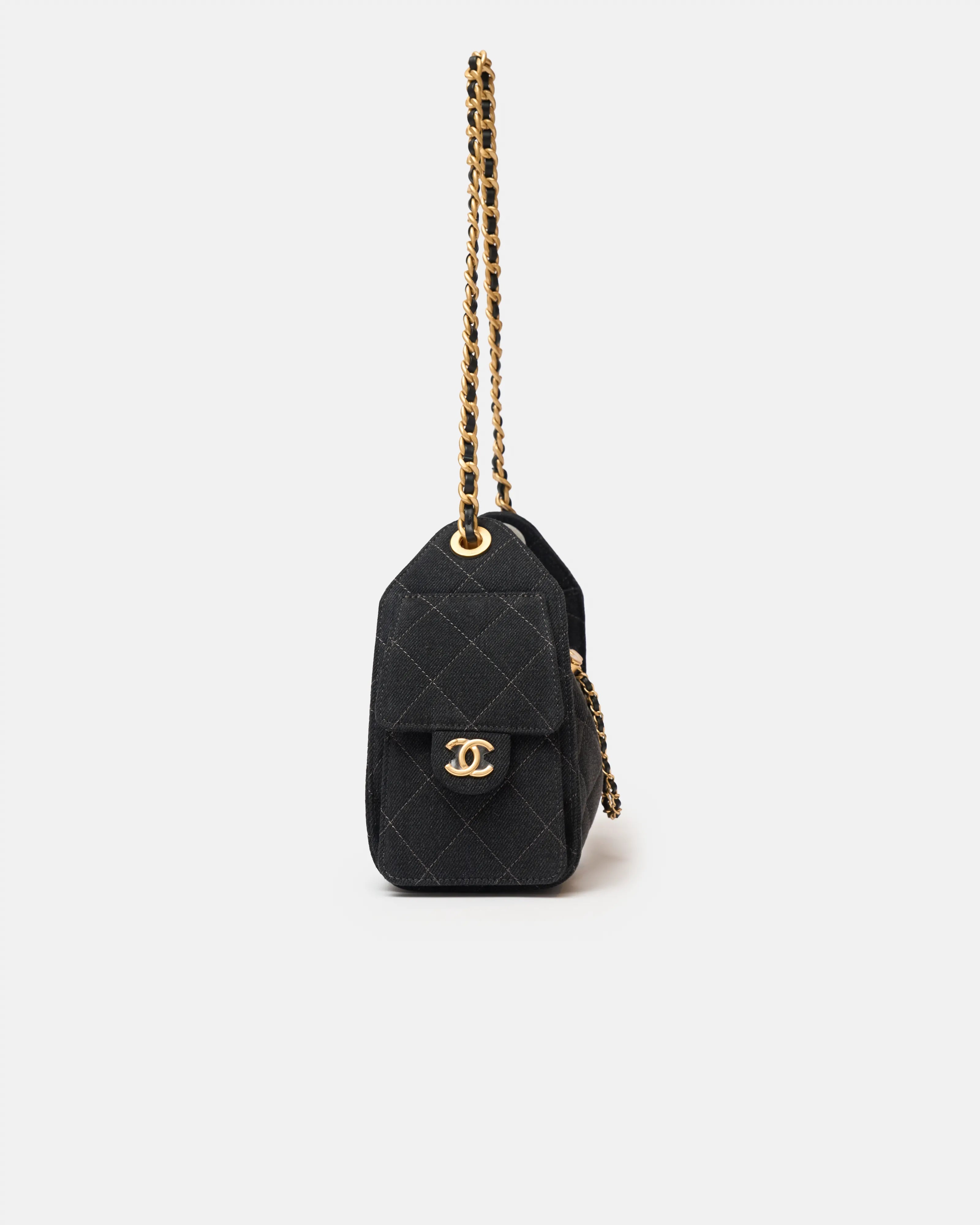 Chanel 25 shoulder bag in black color and washed denim material in GHW 