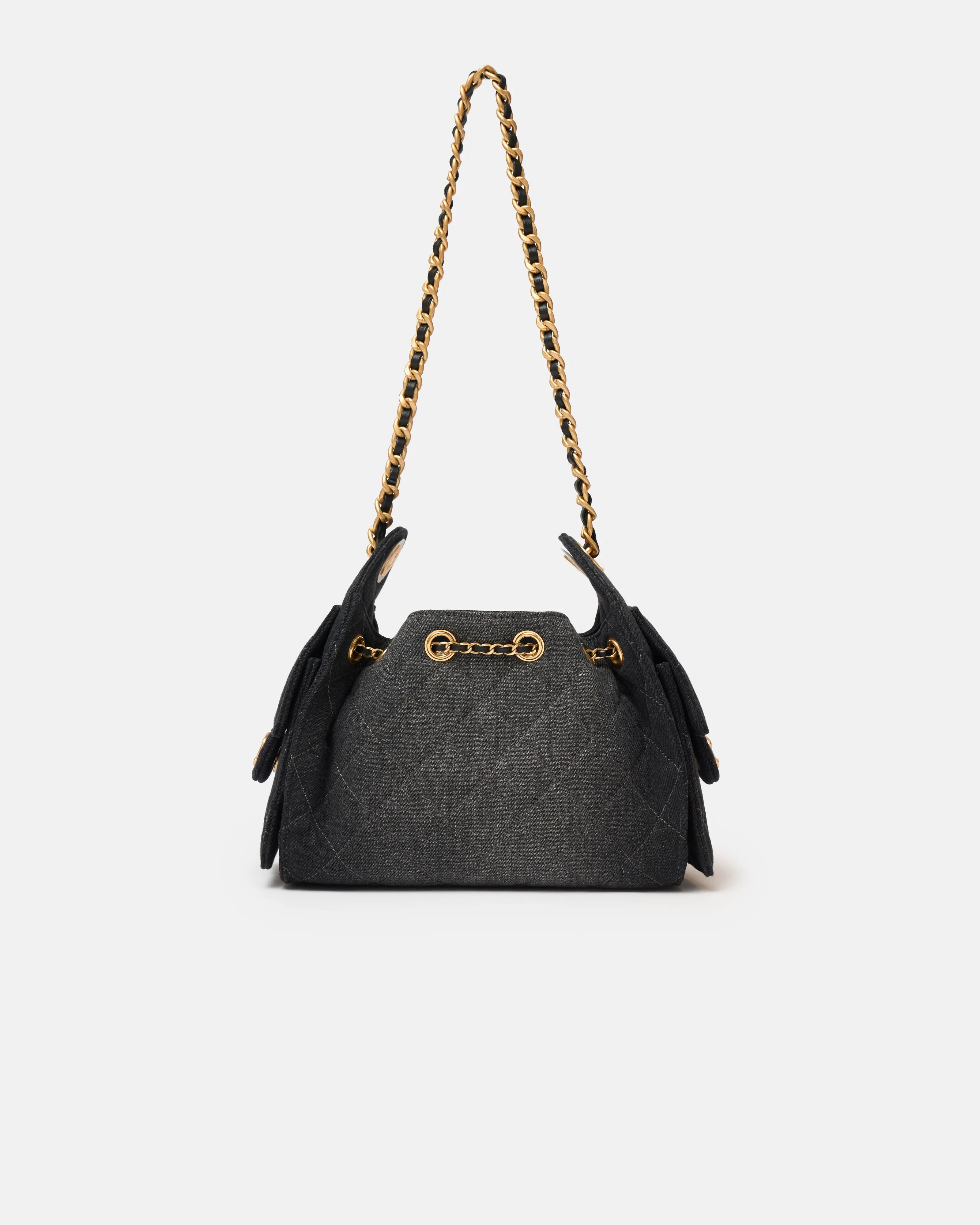 Chanel 25 shoulder bag in black color and washed denim material in GHW 