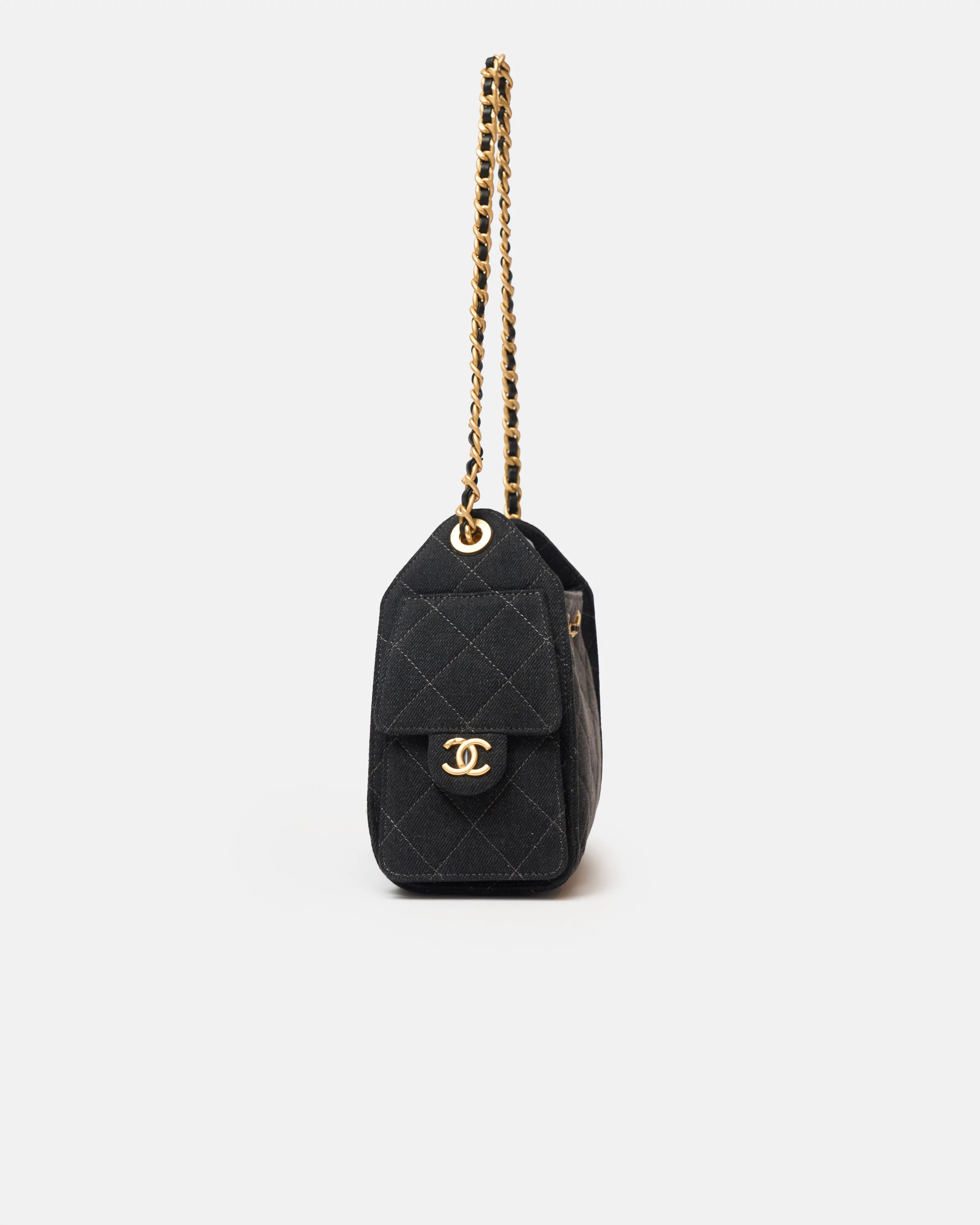 Chanel 25 shoulder bag in black color and washed denim material in GHW 