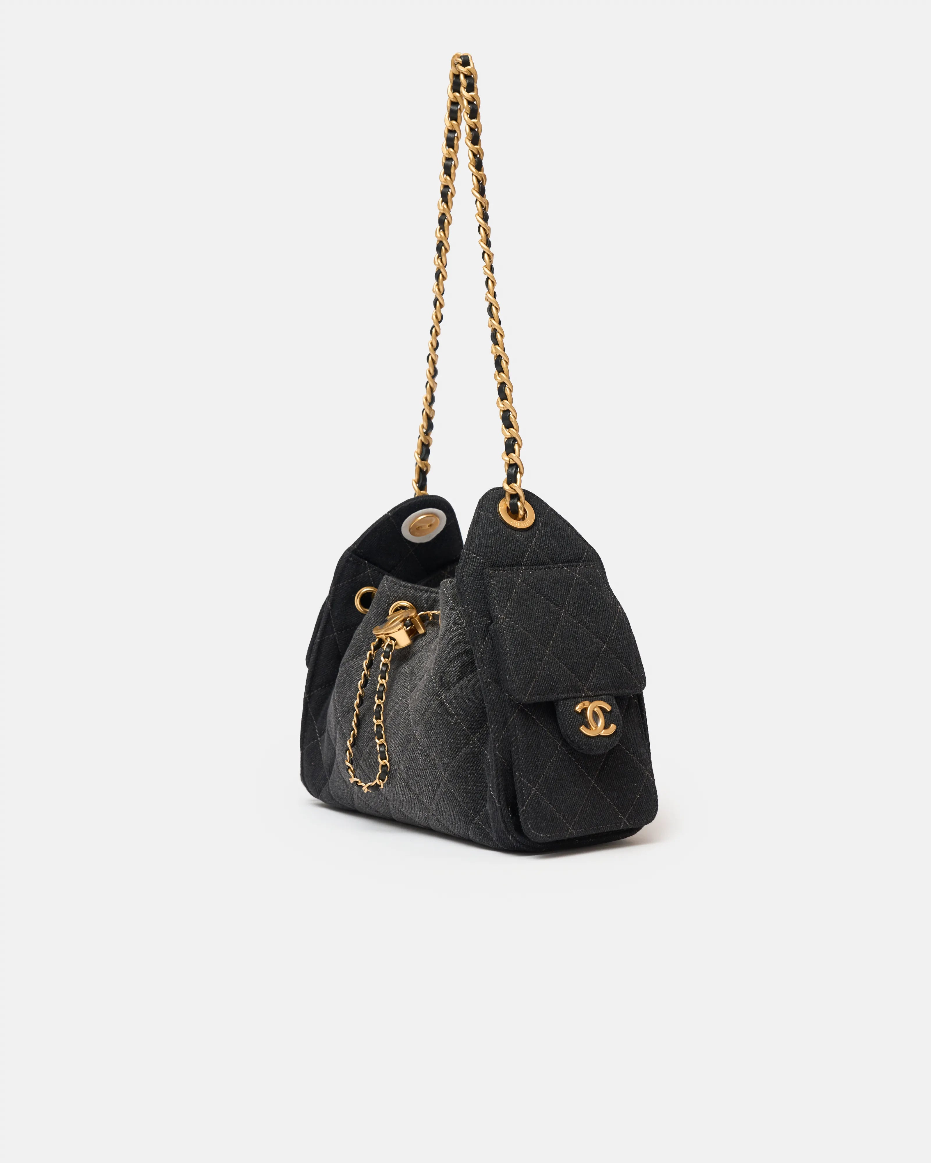 Chanel 25 shoulder bag in black color and washed denim material in GHW 