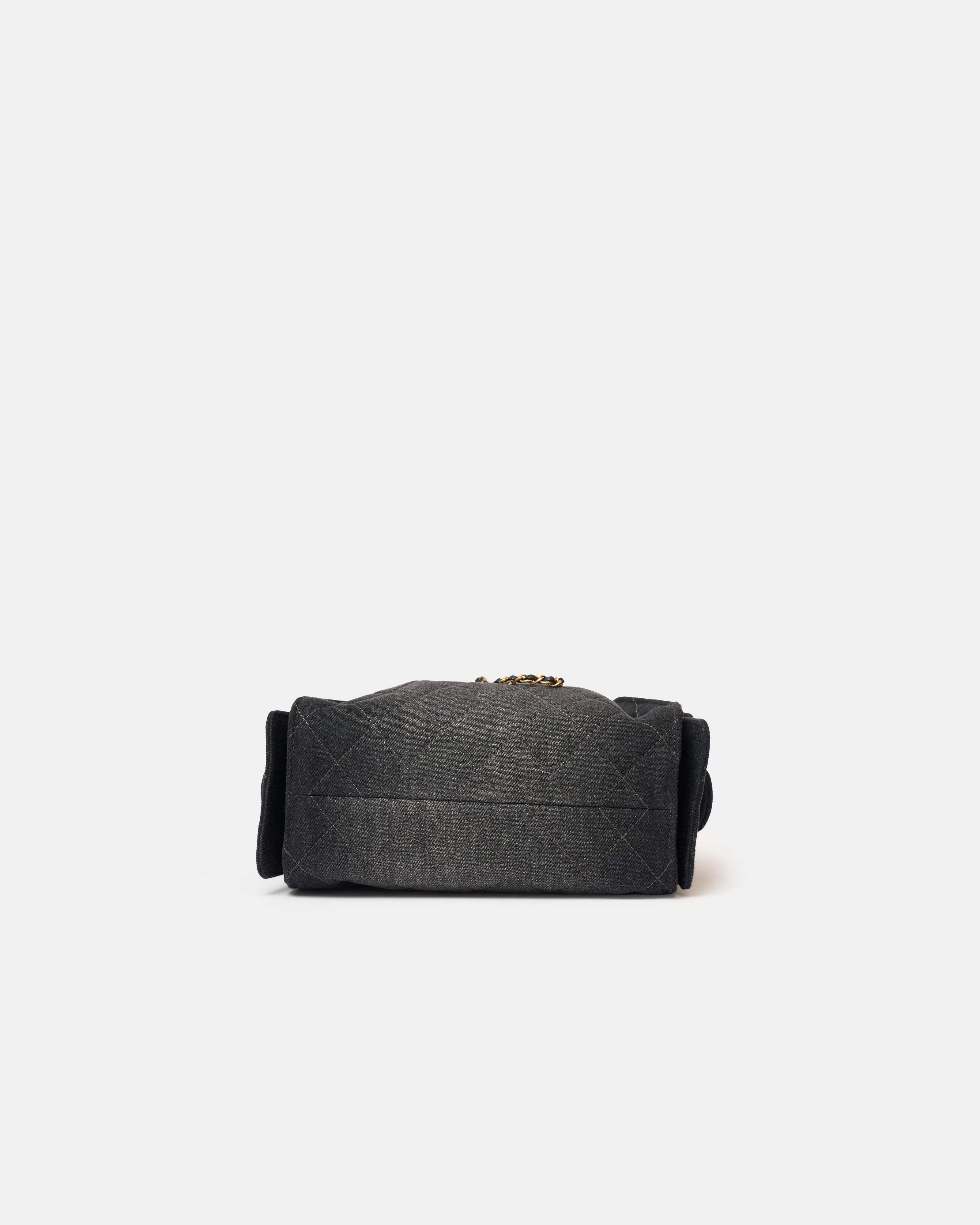 Chanel 25 shoulder bag in black color and washed denim material in GHW 