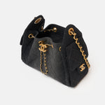 Chanel 25 shoulder bag in black color and washed denim material in GHW 