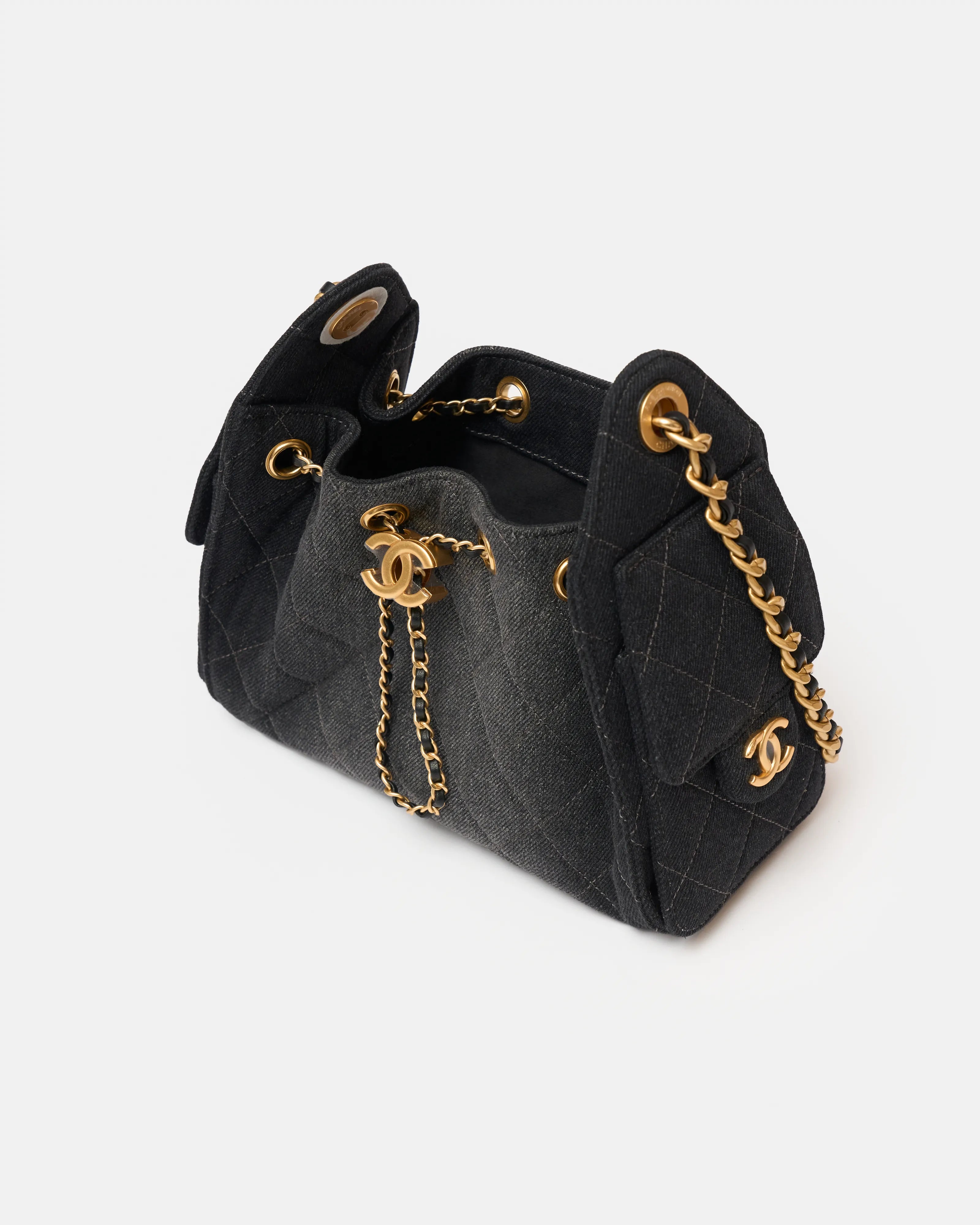 Chanel 25 shoulder bag in black color and washed denim material in GHW 