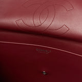 Chanel maxi flap shoulder bag in black color and grained calfskin material in PHW 