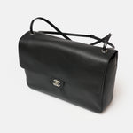 Chanel maxi flap shoulder bag in black color and grained calfskin material in PHW 