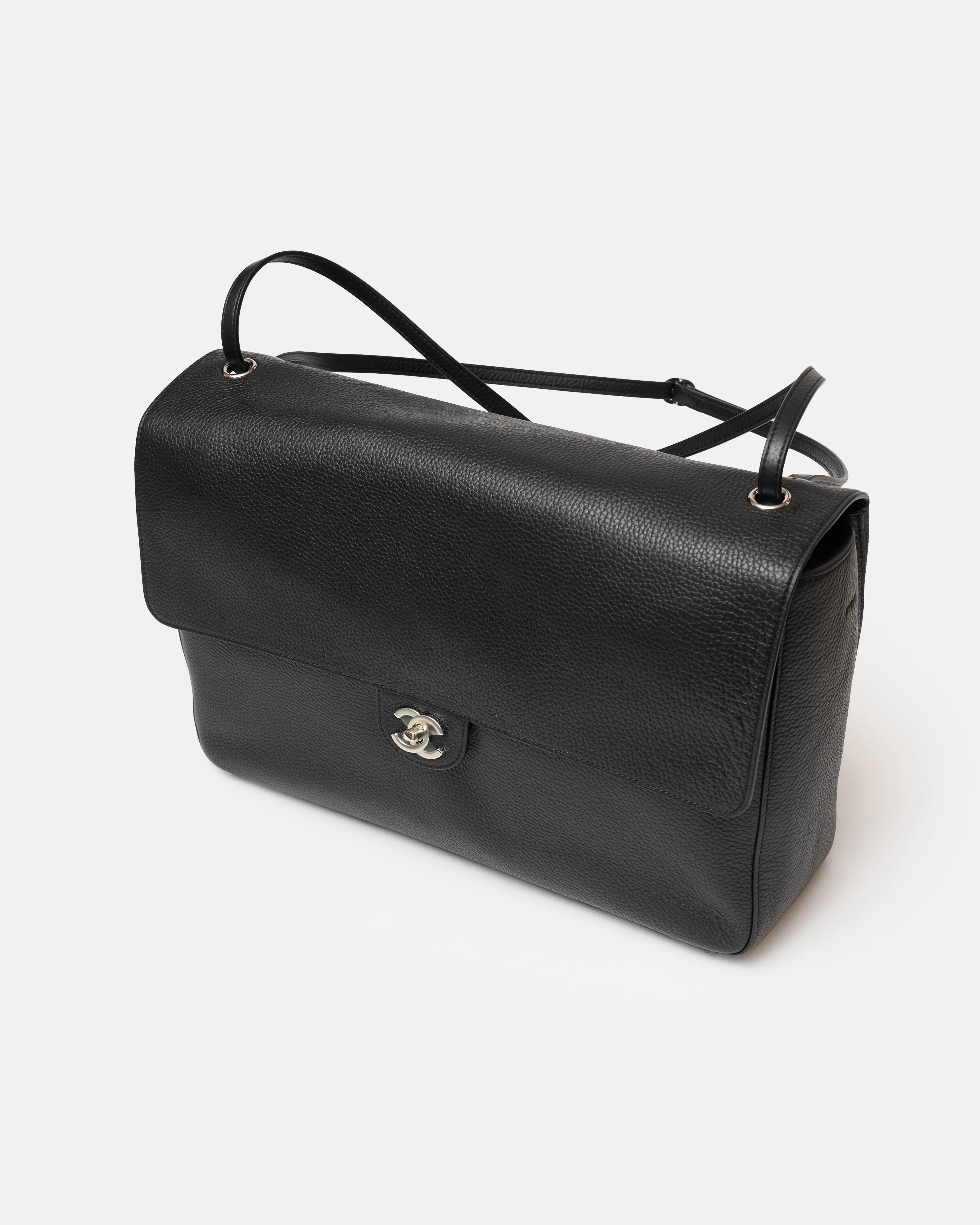 Chanel maxi flap shoulder bag in black color and grained calfskin material in PHW 