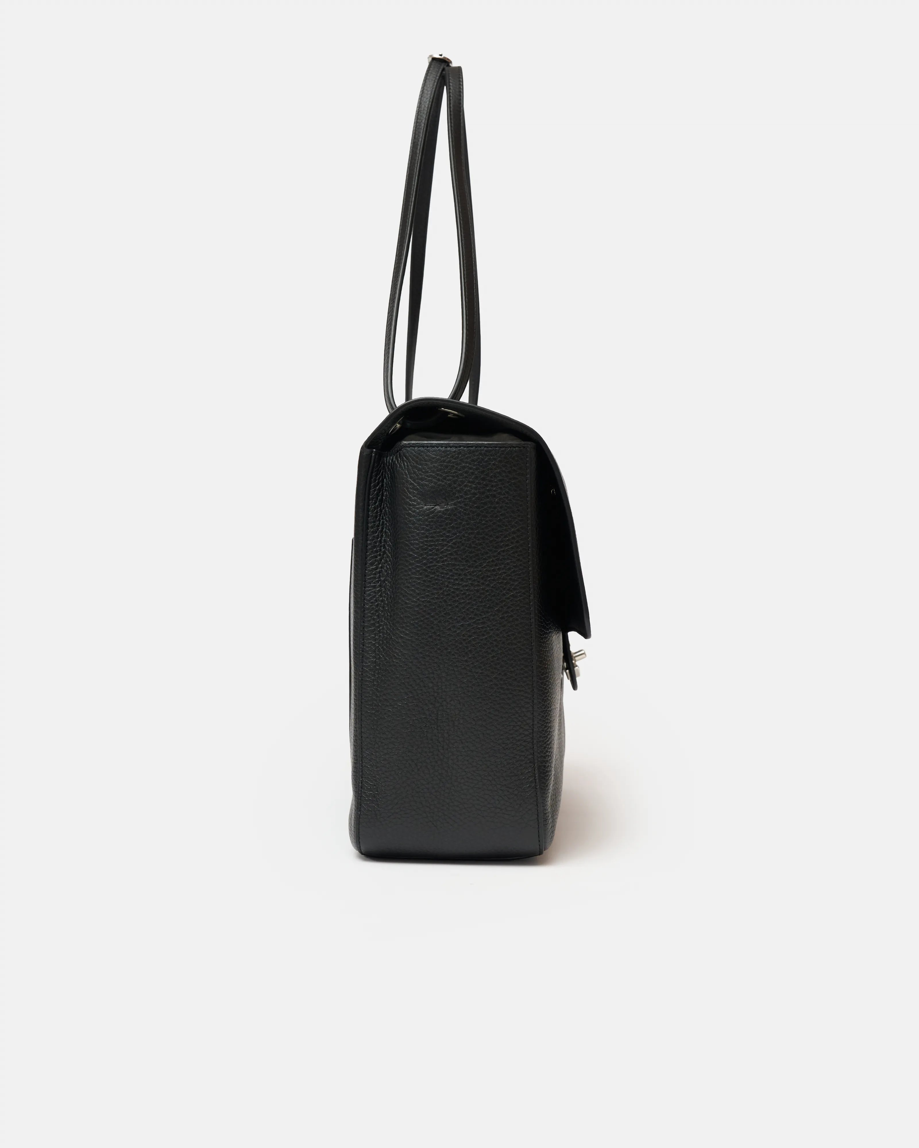 Chanel maxi flap shoulder bag in black color and grained calfskin material in PHW