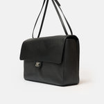 Chanel maxi flap shoulder bag in black color and grained calfskin material in PHW 