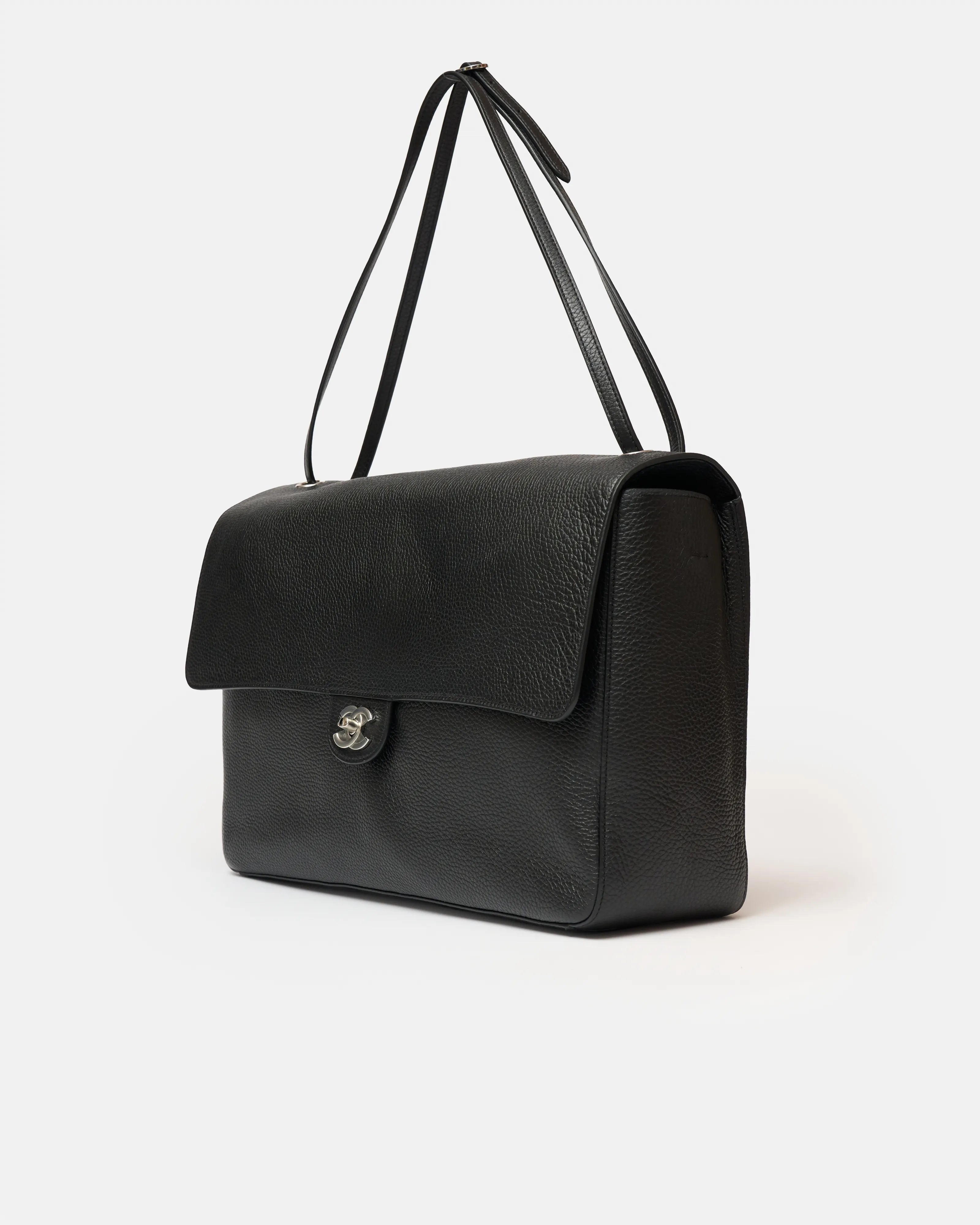 Chanel maxi flap shoulder bag in black color and grained calfskin material in PHW 