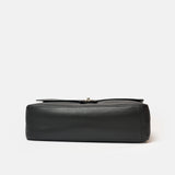 Chanel maxi flap shoulder bag in black color and grained calfskin material in PHW 