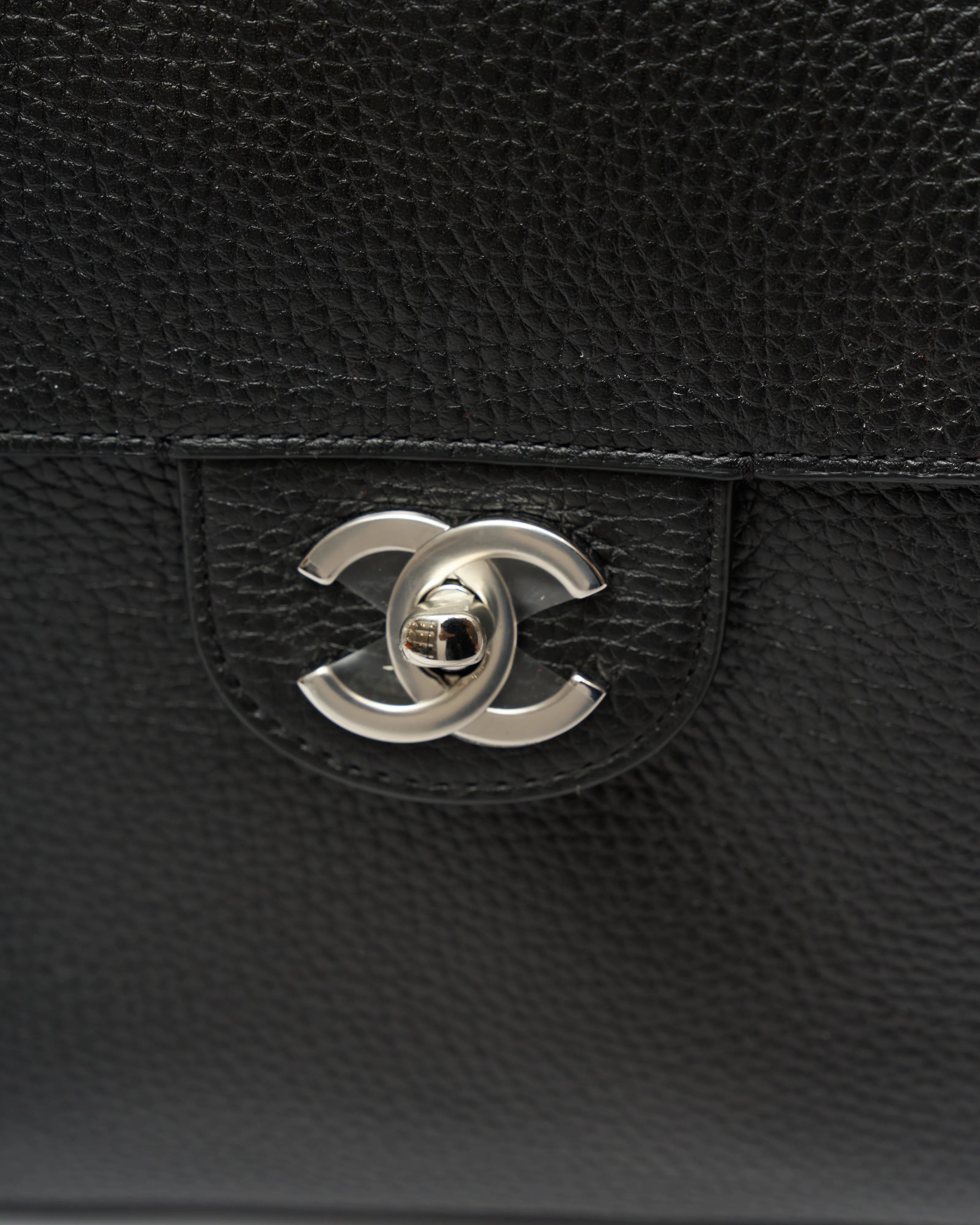 Chanel maxi flap shoulder bag in black color and grained calfskin material in PHW 