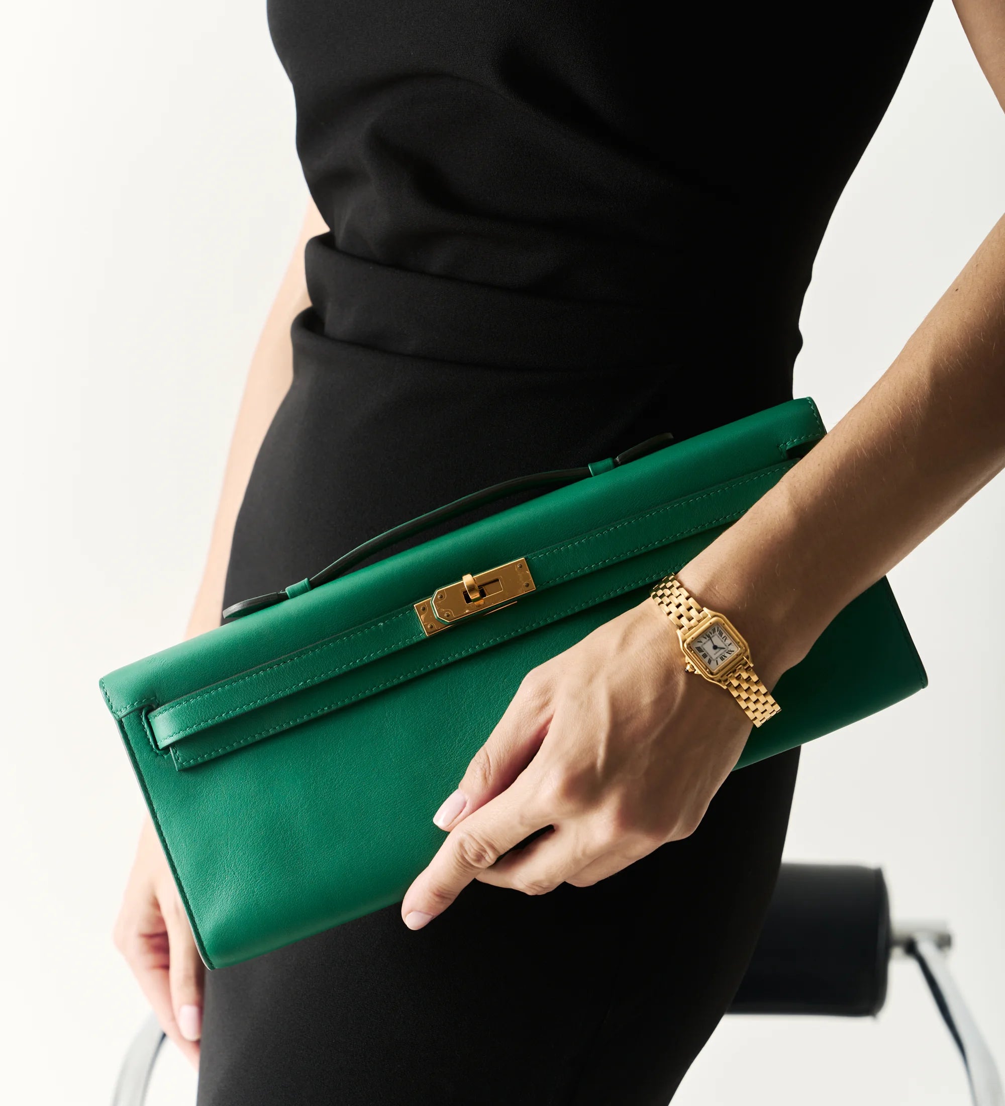 Green Hermès Kelly Cut clutch with gold hardware featured in Selectif’s Special Prices edit