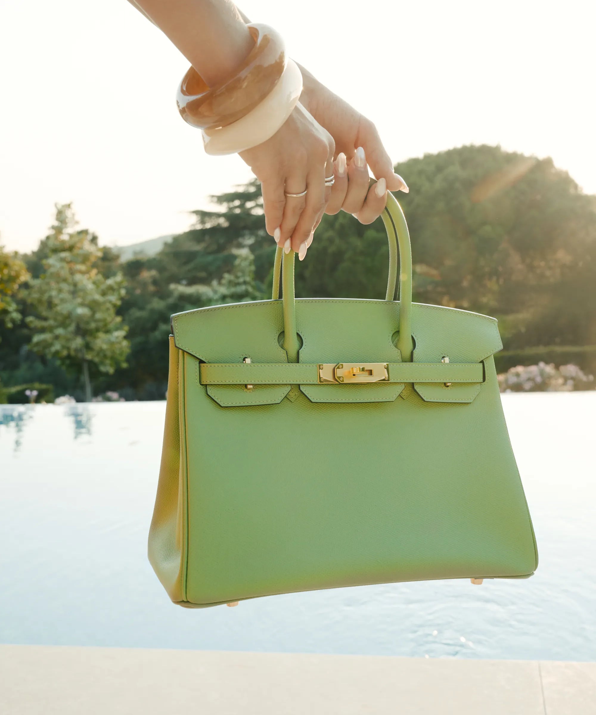 Hermès Birkin 30 Vert Criquet bag with gold hardware styled poolside