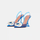 Amina Muaddi Rosie Glass PVC transparent blue slingback pumps with crystal buckle detail