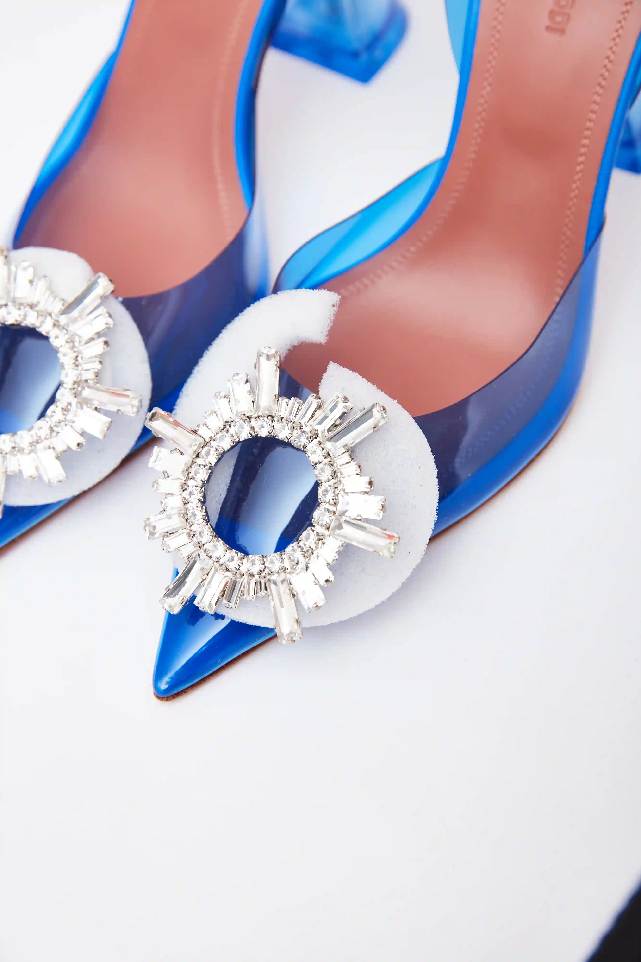 Amina Muaddi Rosie Glass PVC transparent blue slingback pumps with crystal buckle detail