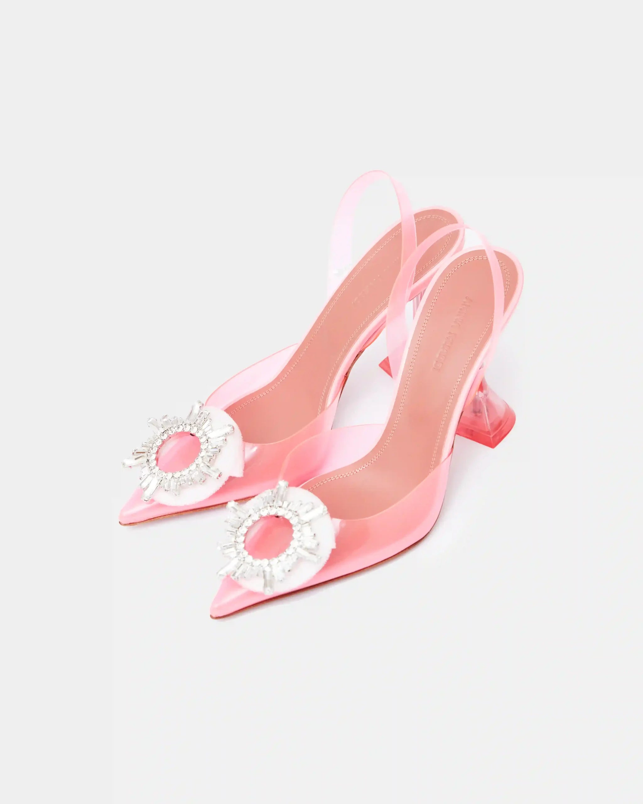 Amina Muaddi Rosie Glass PVC pink transparent slingback pumps with crystal buckle detail