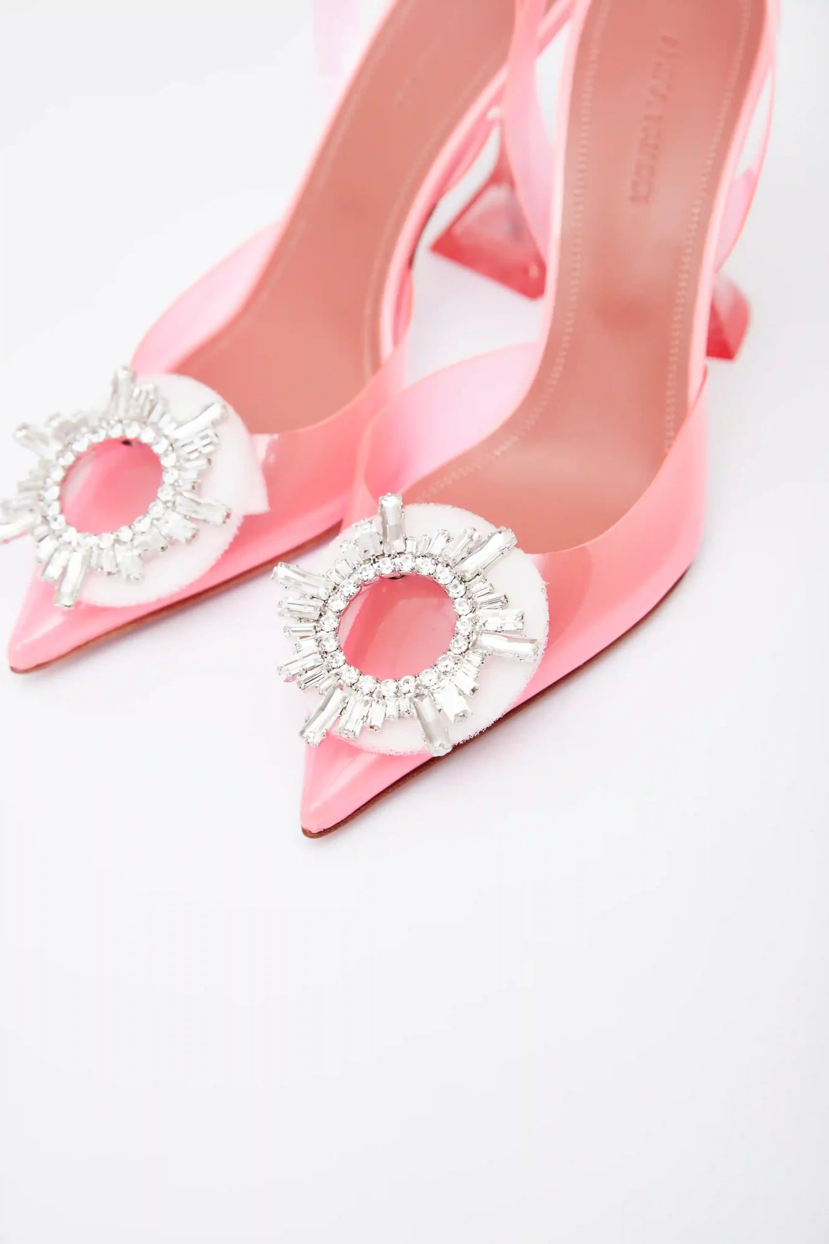 Amina Muaddi Rosie Glass PVC pink transparent slingback pumps with crystal buckle detail