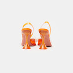 Amina Muaddi Rosie Glass PVC orange transparent slingback heels with crystal bow detail
