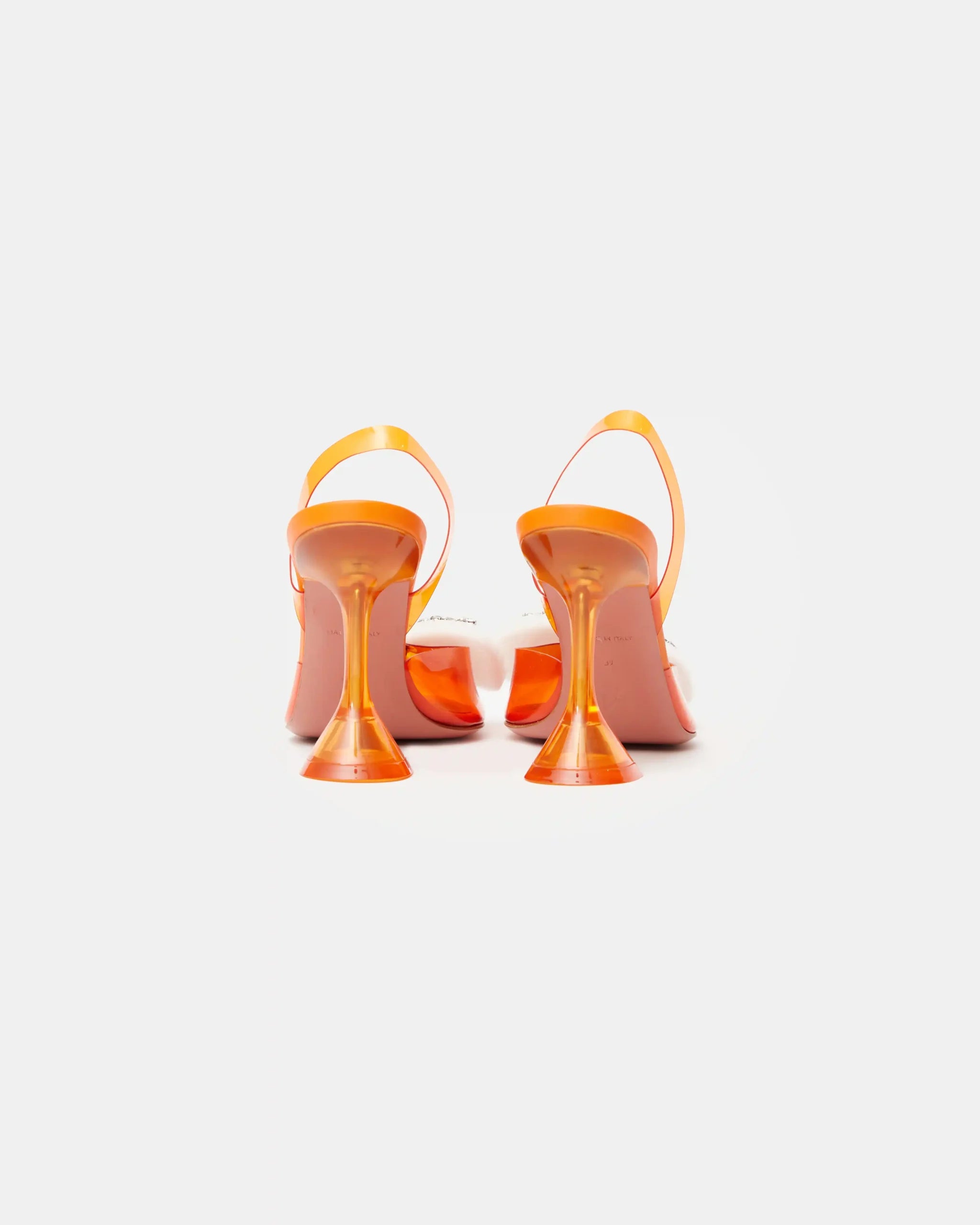 Amina Muaddi Rosie Glass PVC orange transparent slingback heels with crystal bow detail