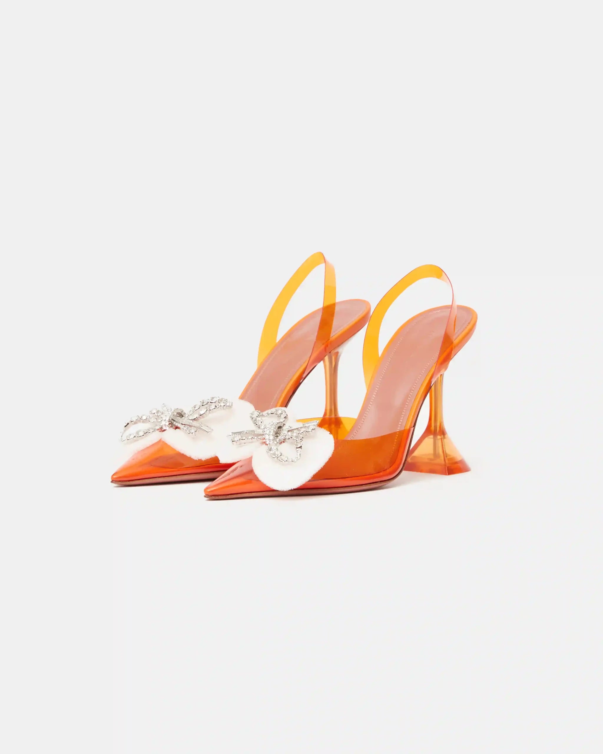 Amina Muaddi Rosie Glass PVC orange transparent slingback heels with crystal bow detail