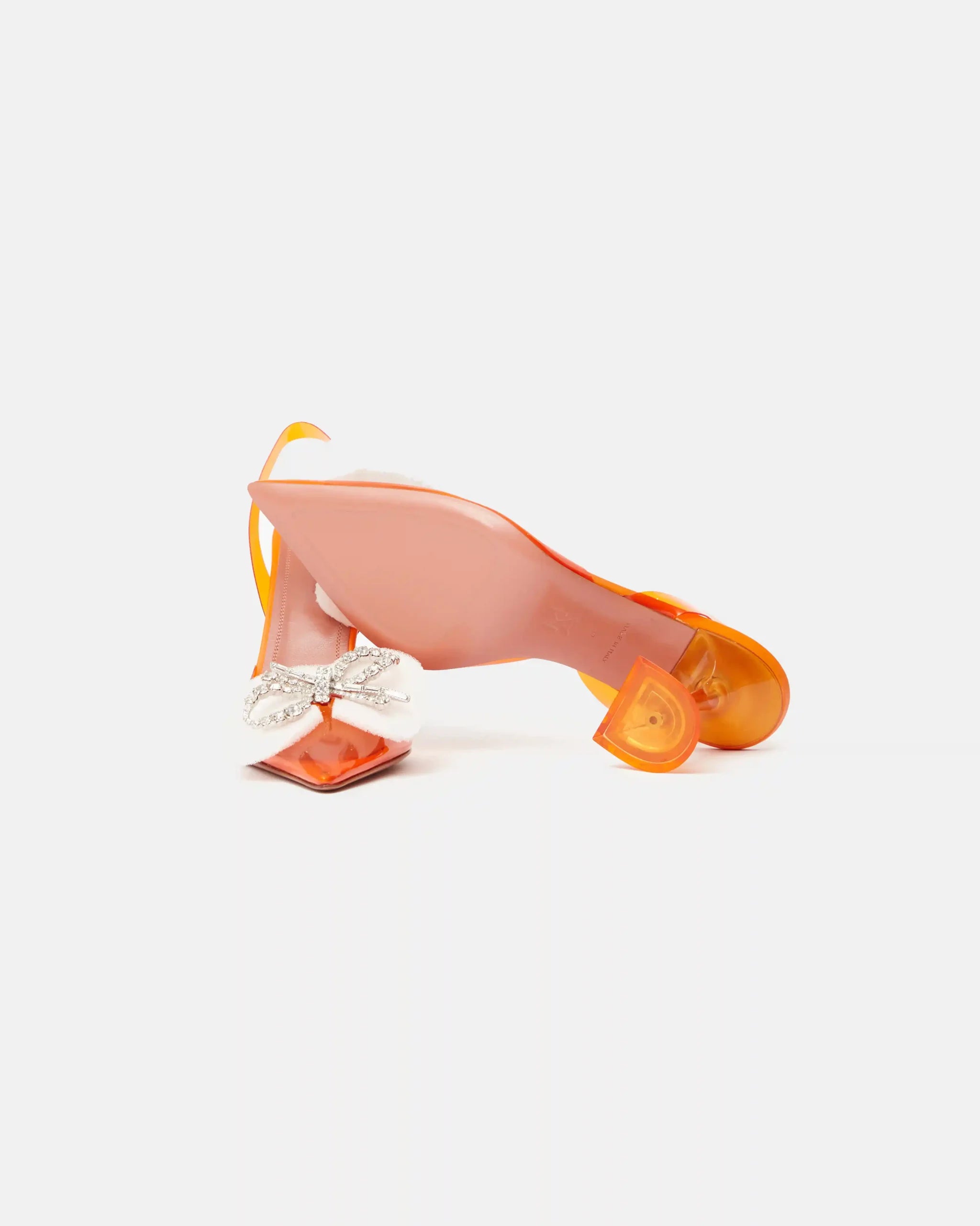 Amina Muaddi Rosie Glass PVC orange transparent slingback heels with crystal bow detail