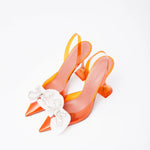Amina Muaddi Rosie Glass PVC orange transparent slingback heels with crystal bow detail
