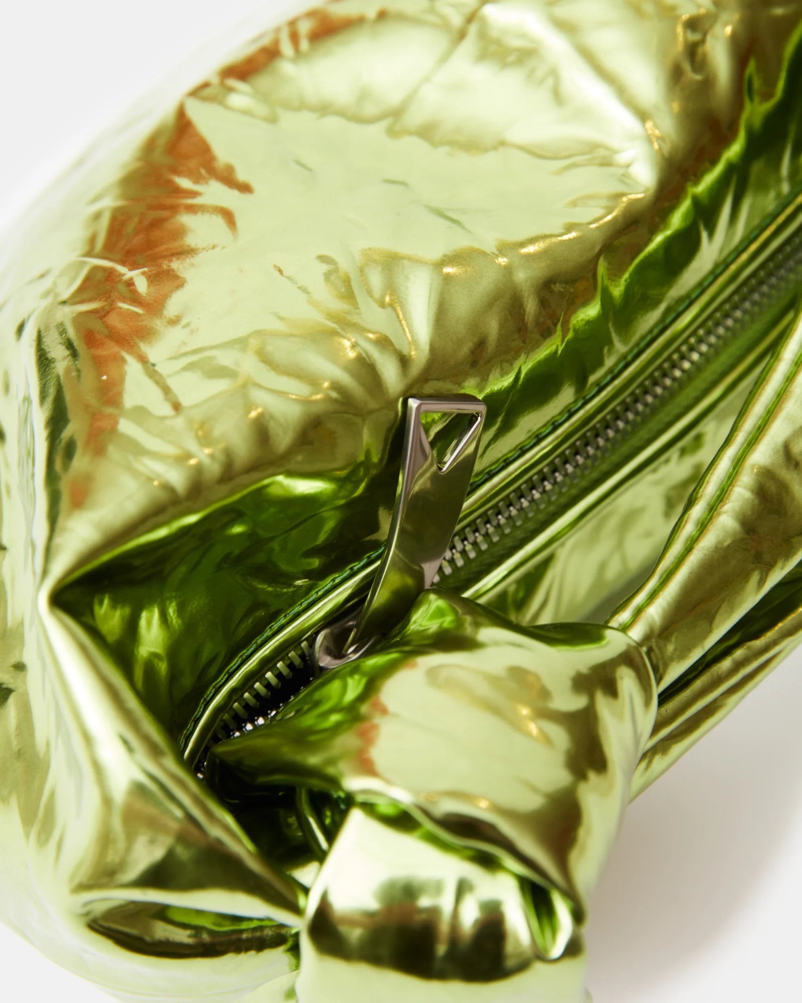 Bottega Veneta Jodie Mini Clutch bag in Chlorophyll color and Mettalic Leather