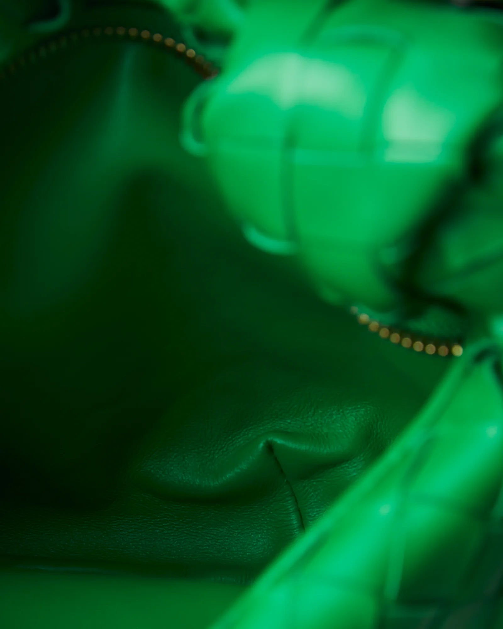Bottega Veneta Jodie Mini Clutch bag in green Intrecciato woven leather with a knotted handle