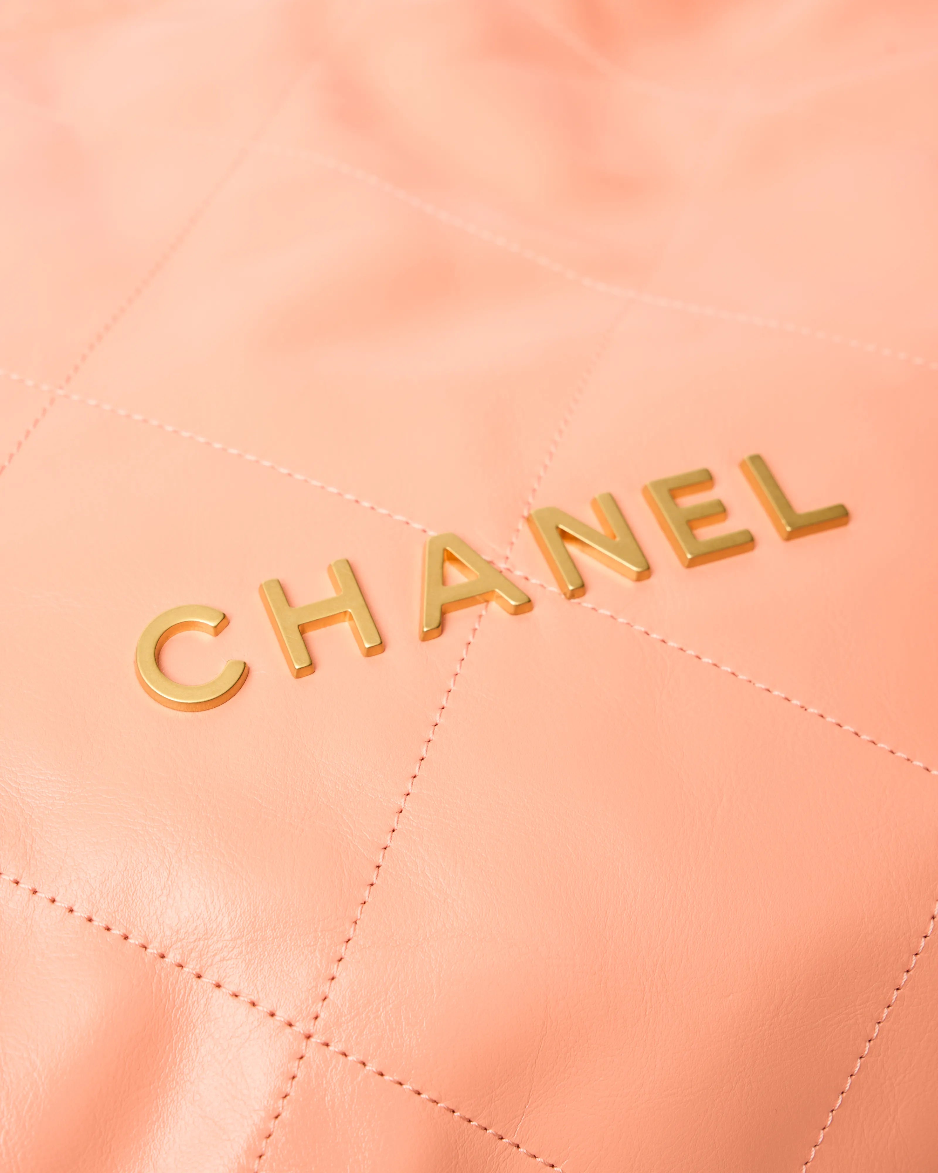 Chanel 22 Handbag in light orange color and Shiny Calfskin leather in GHW 