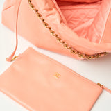 Chanel 22 Handbag in light orange color and Shiny Calfskin leather in GHW 