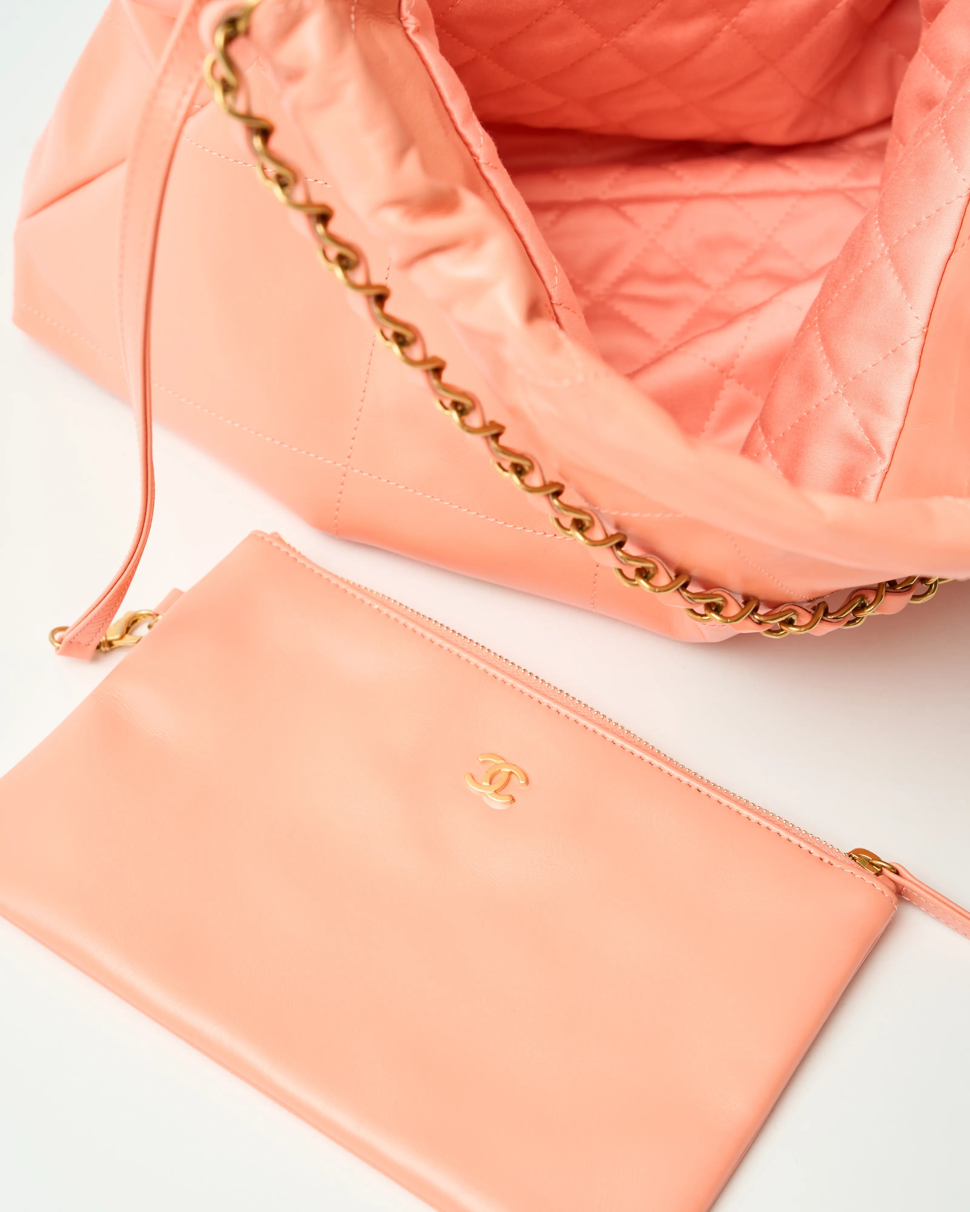 Chanel 22 Handbag in light orange color and Shiny Calfskin leather in GHW 