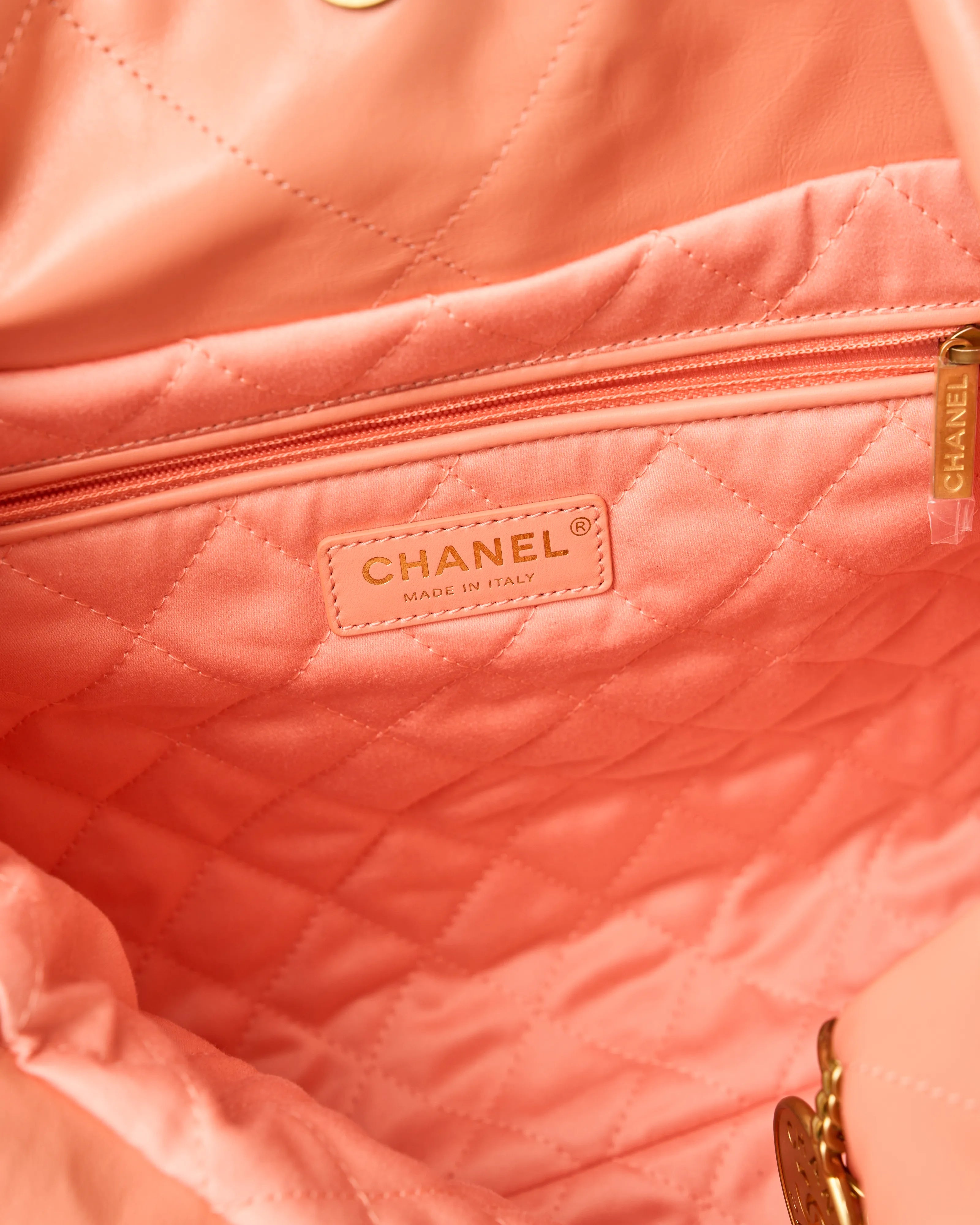 Chanel 22 Handbag in light orange color and Shiny Calfskin leather in GHW 