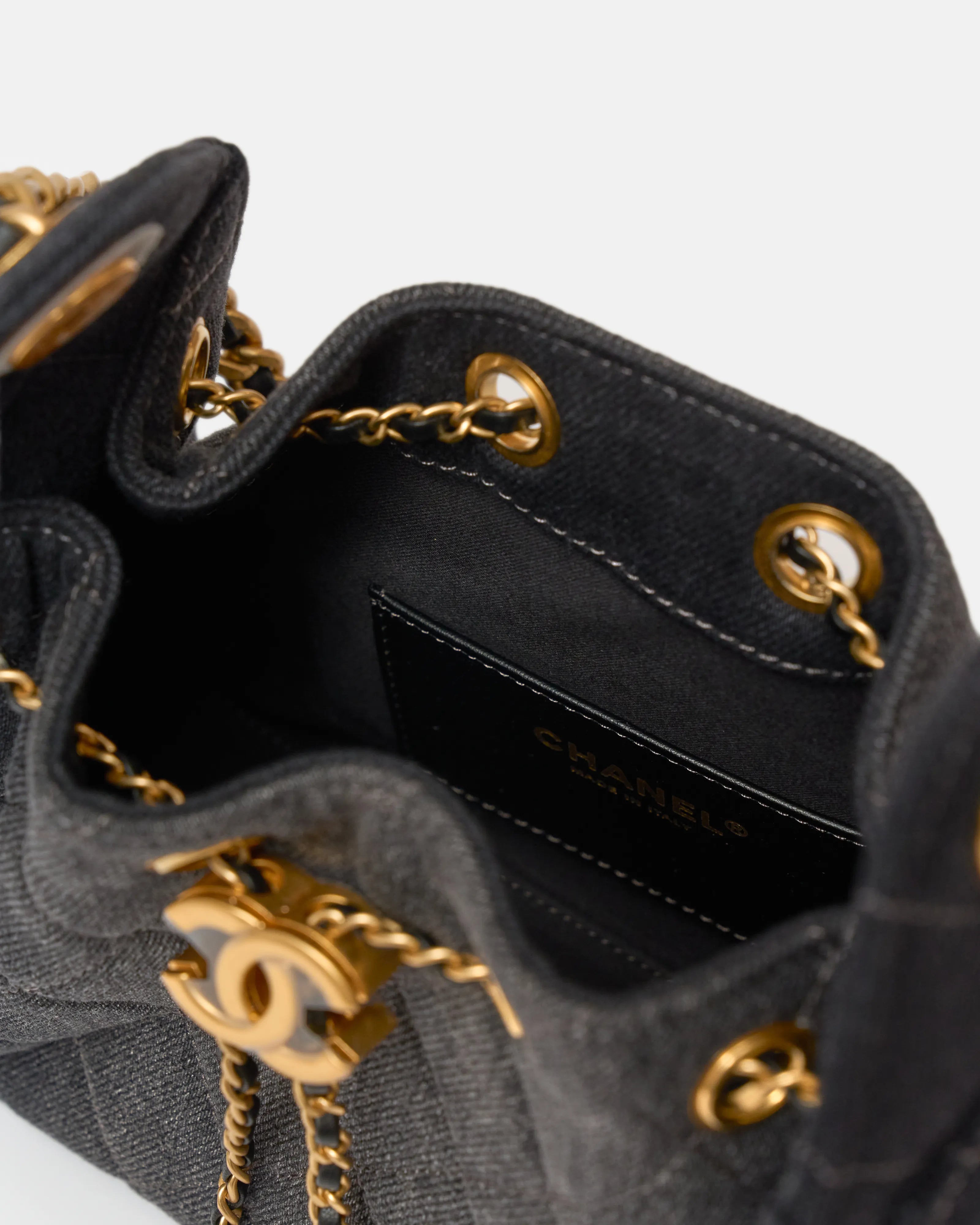 Chanel 25 shoulder bag in black color and washed denim material in GHW 