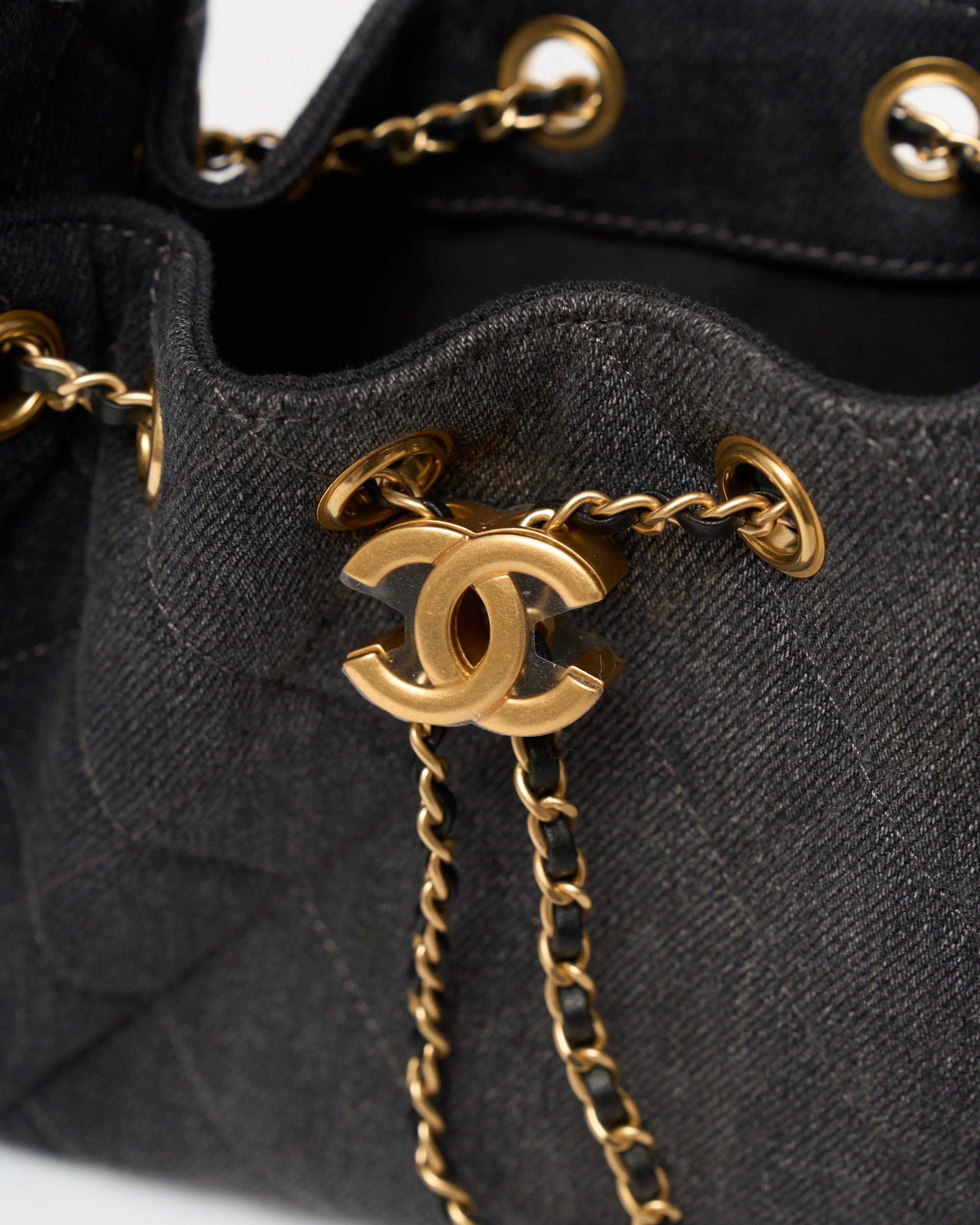 Chanel 25 shoulder bag in black color and washed denim material in GHW 