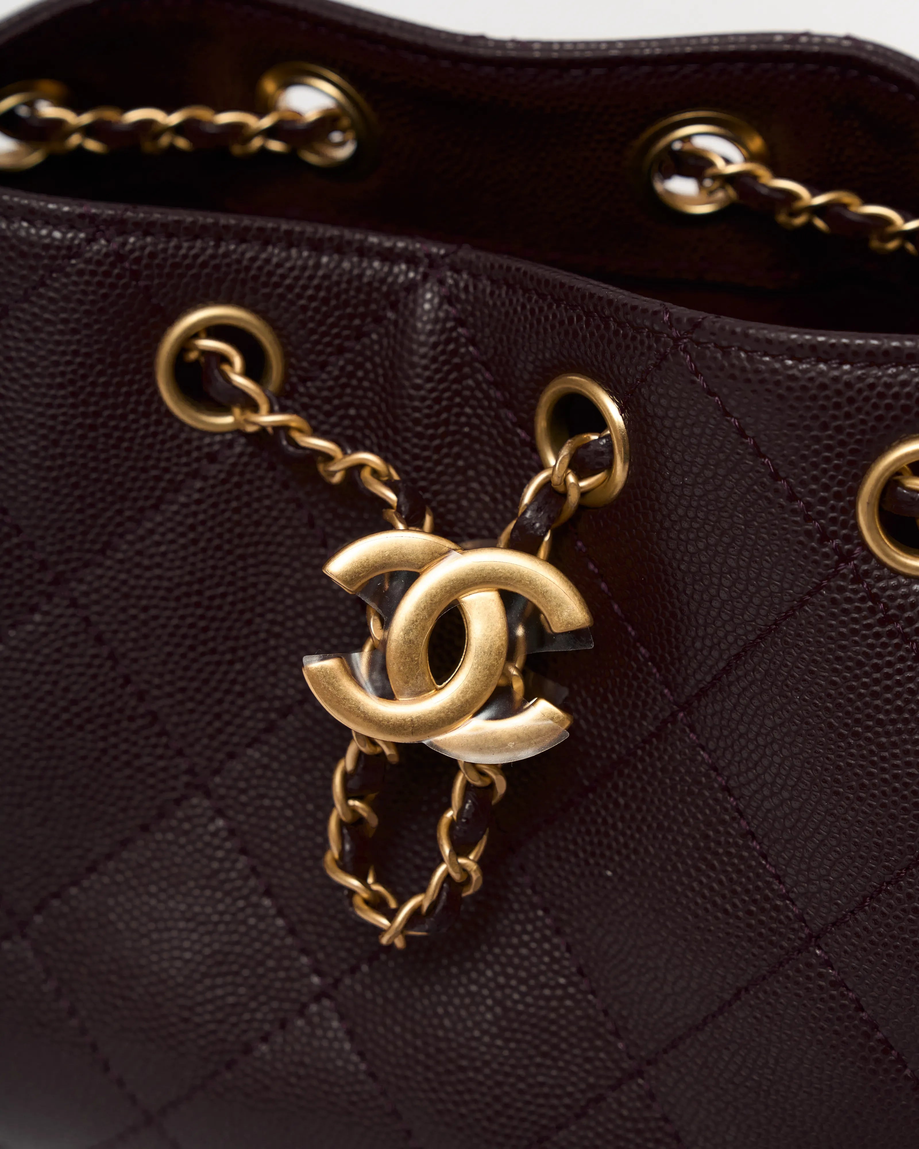Chanel 25 shoulder bag in brown color and grained calfskin material in GHW 