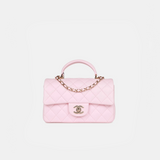 Chanel Classic Mini Flap Top Handle crossbody bag in Light Pink color and Lambskin quilted leather in GHW